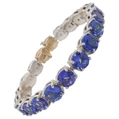 925 and 14 Karat Gold Blue 42.91 Carat Tanzanite Tennis Line Bracelet
