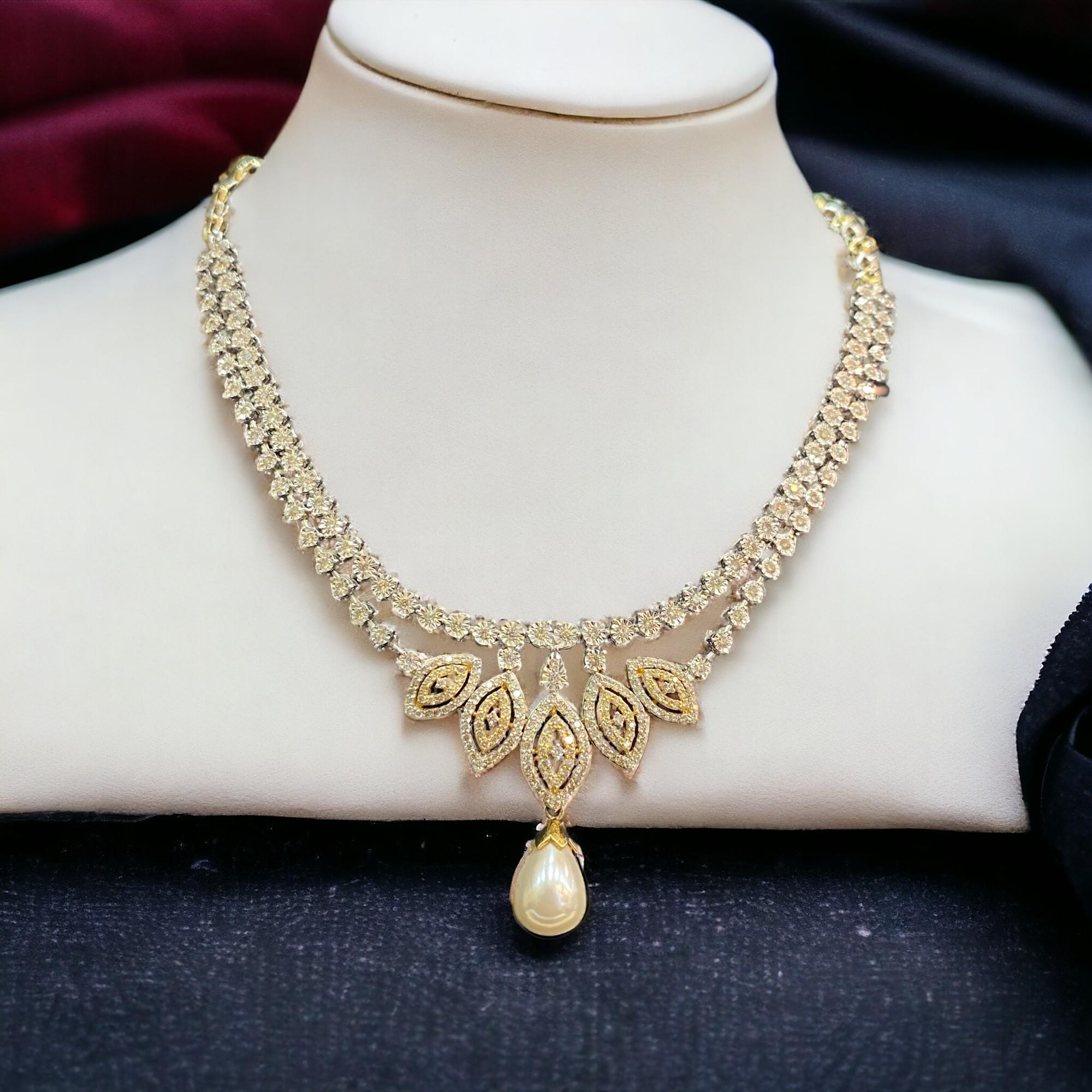 This Pearl Necklace Represents Glamour In Its Most Blissful Form. Gift Yourself This Astounding 9.25 Carat Round Brilliant-Cut Natural Diamond Pearl Necklace In Authentic 14K Two-Tone Gold, Meant To Make You Smile And Glow Endlessly!

Specifications