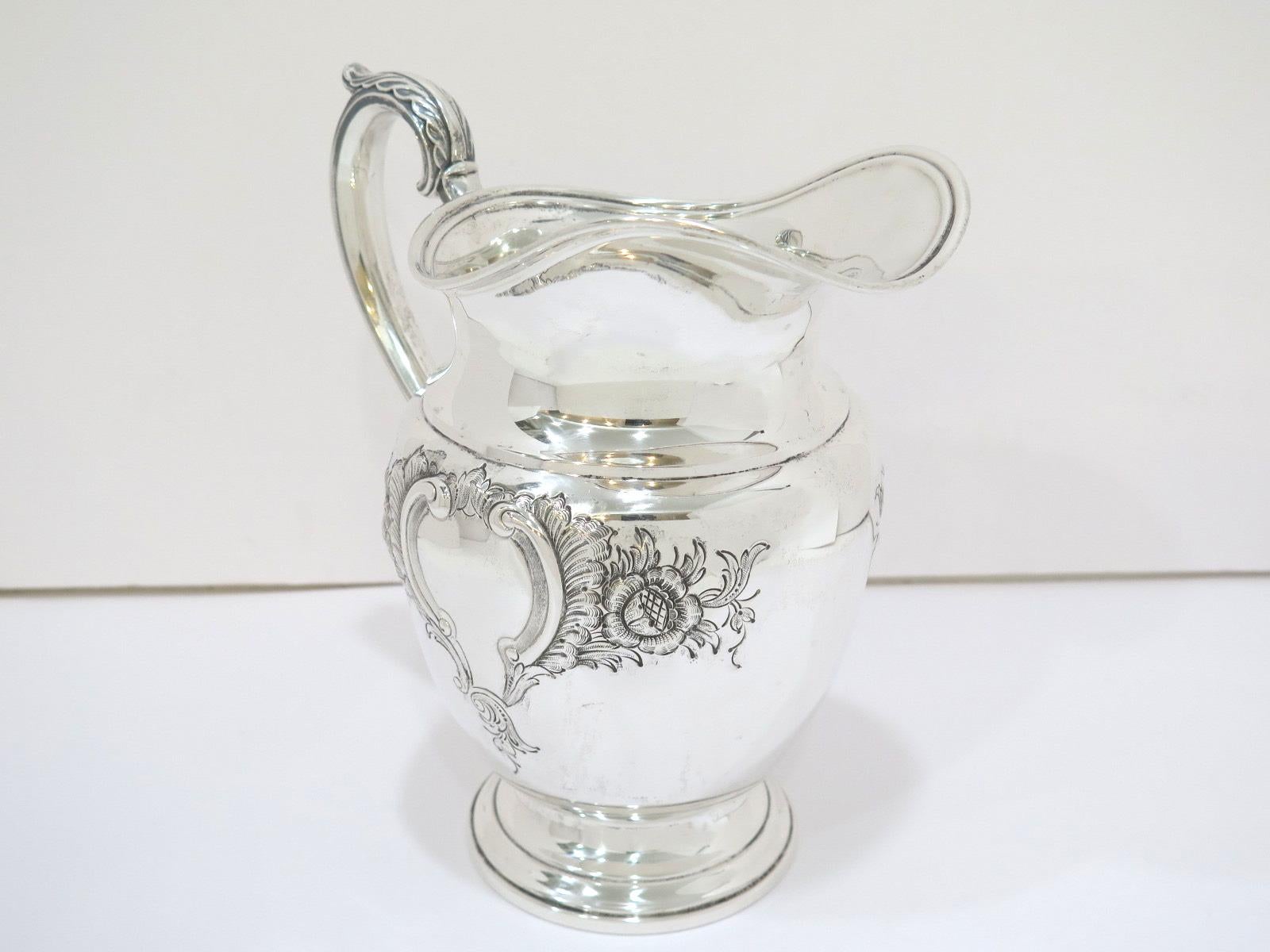 American 9.25 in - Sterling Silver International Sterling Antique Floral Pitcher For Sale