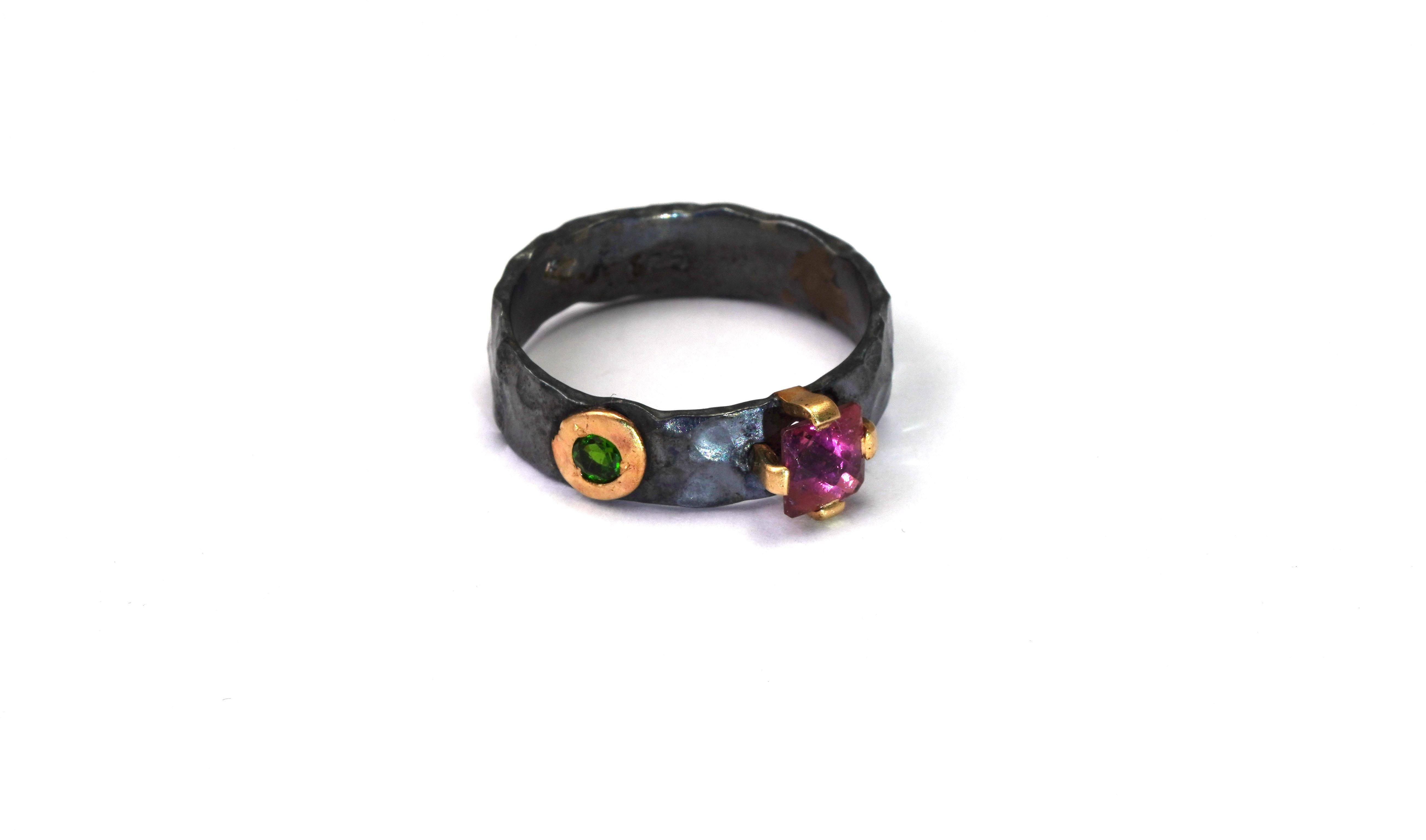 925 Oxidized Silver Ring with Tourmaline Rubellite and Green Tsavorite
Gold kt: Solid 18 kt 
Gold color: Yellow
Ring size: 5 1/4 US
Total weight: 2.70 grams

Set with:
- Tourmaline Rubellite
Cut: Mixed
Color: Red
- Green Tsavorite
Cut: