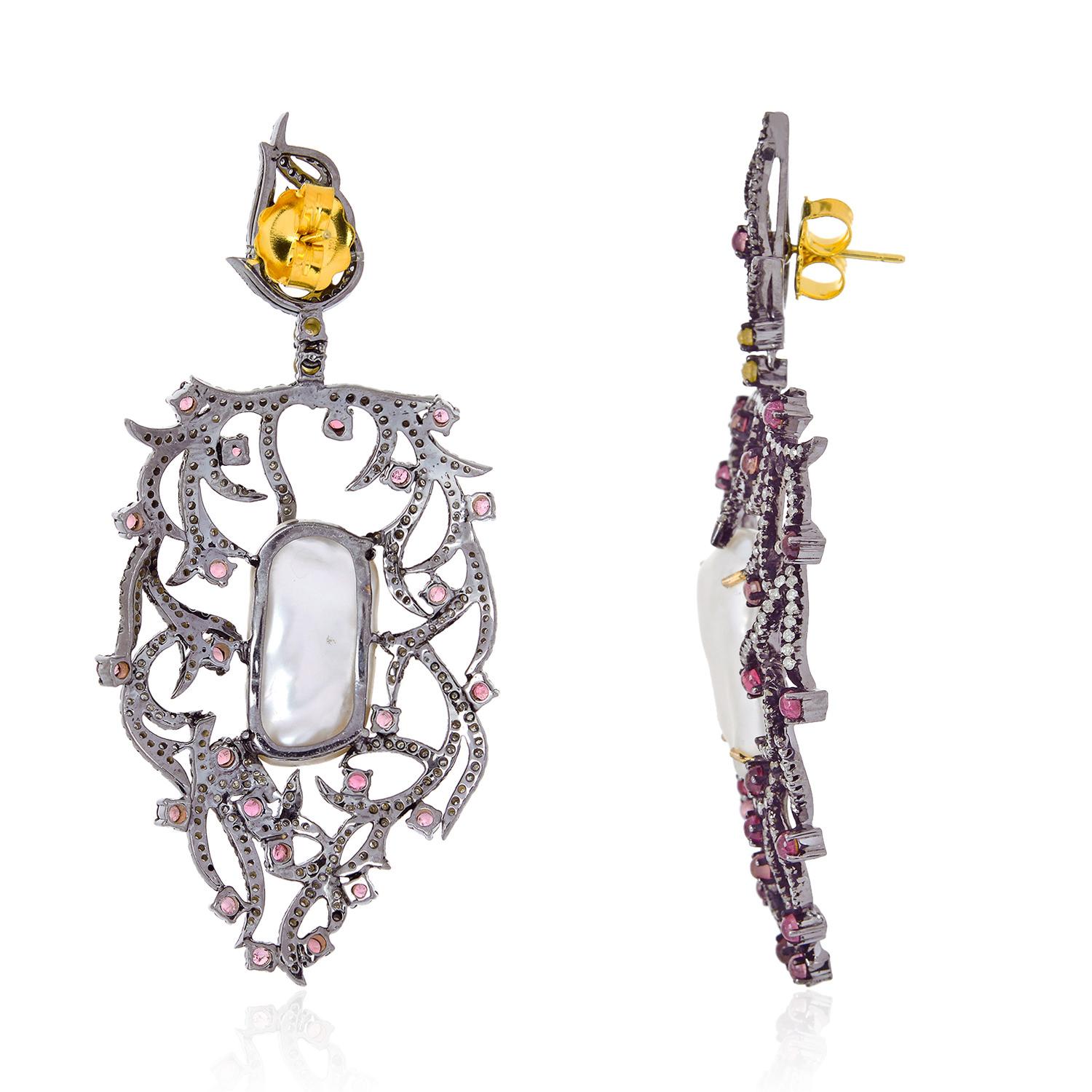 .925 Silver 18k Gold 24.70 Ct Pearl Diamond Pave Pink Tourmaline Dangle Earrings

24.70 CT Pearl and 4.41 Carat Round cut diamonds 3.52 Carat Pink Tourmaline set in .925 Sterling Silver and 18k Gold Dangle Earrings.

We guarantee all products sold