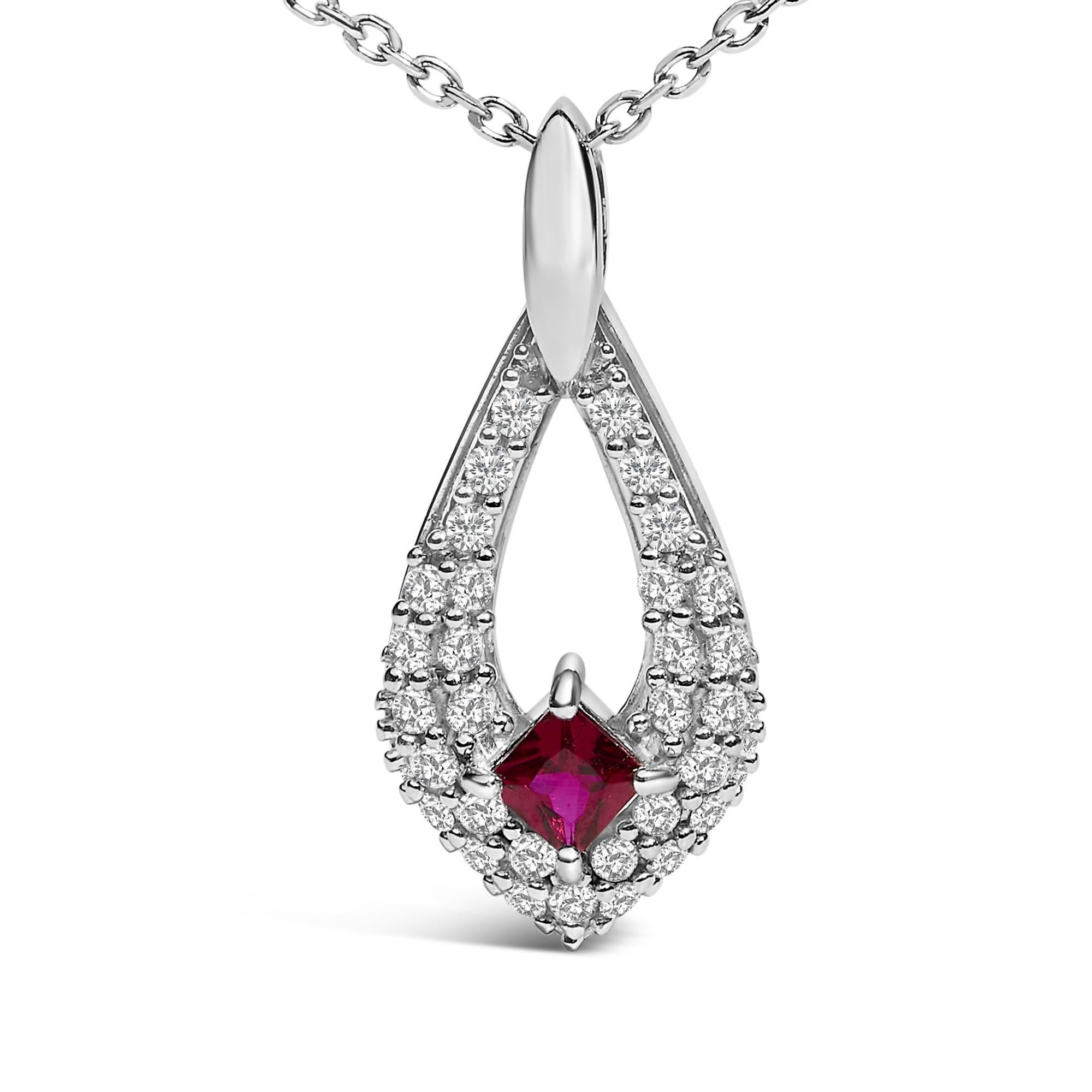 Indulge in the luxurious allure of this splendid necklace, crafted from rhodium-plated .925 sterling silver for a lustrous finish that promises lasting brilliance. At its heart lies a lab-created, princess-cut red ruby, its rich hues reminiscent of
