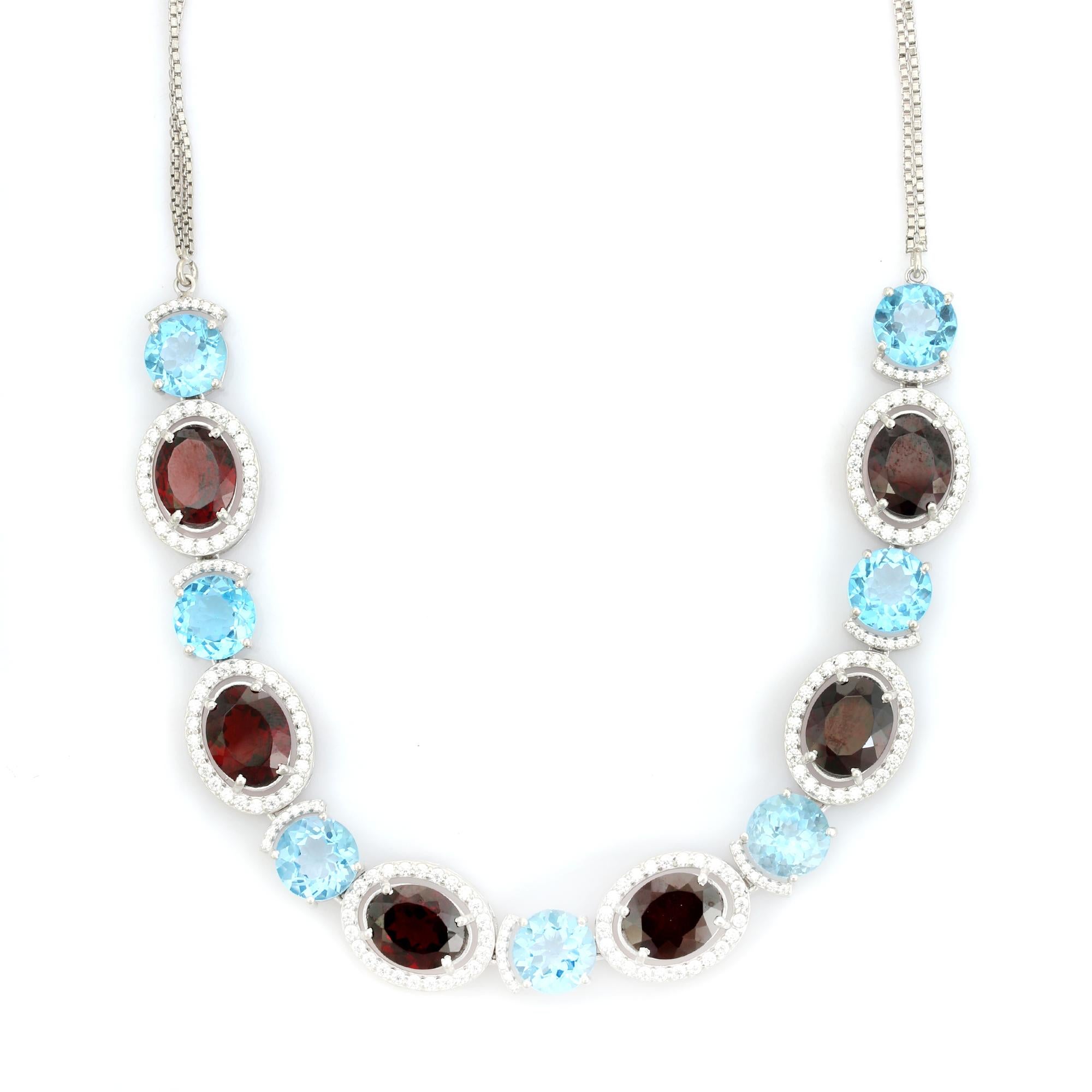 Collar de plata 925 con granate y topacio azul en dos tonos y halo de circonitas cúbicas Corte mixto en venta