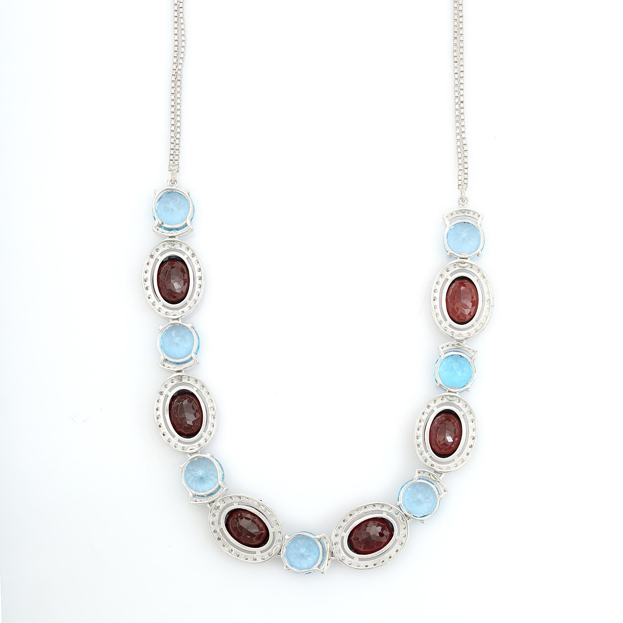 Collar de plata 925 con granate y topacio azul en dos tonos y halo de circonitas cúbicas en venta 1