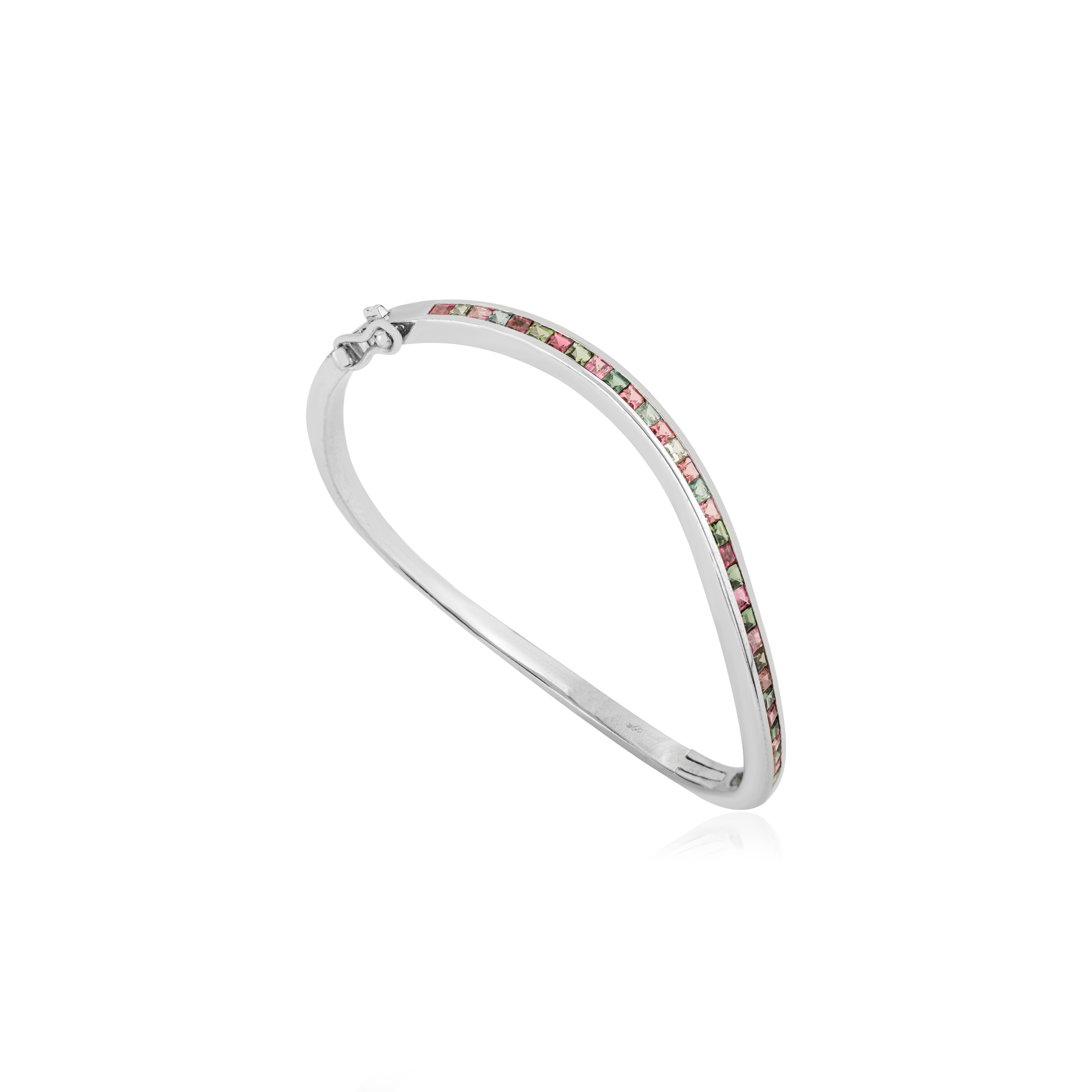 This Multi Tourmaline October Birthstone Wave Cuff Bangle Bracelet elegant 925 silver bangle set with 2.4 carats of natural multi tourmaline gemstones. Each colorful stone enhances positivity, creativity, and confidence. Multi Tourmaline is the