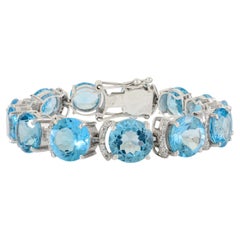 Pulsera ancha de tenis con topacio azul natural y circonitas de plata 925