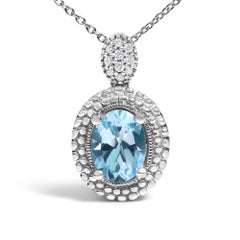 .925 Silver Oval Blue Topaz and Diamond Accent with Beaded Halo Pendant Necklace