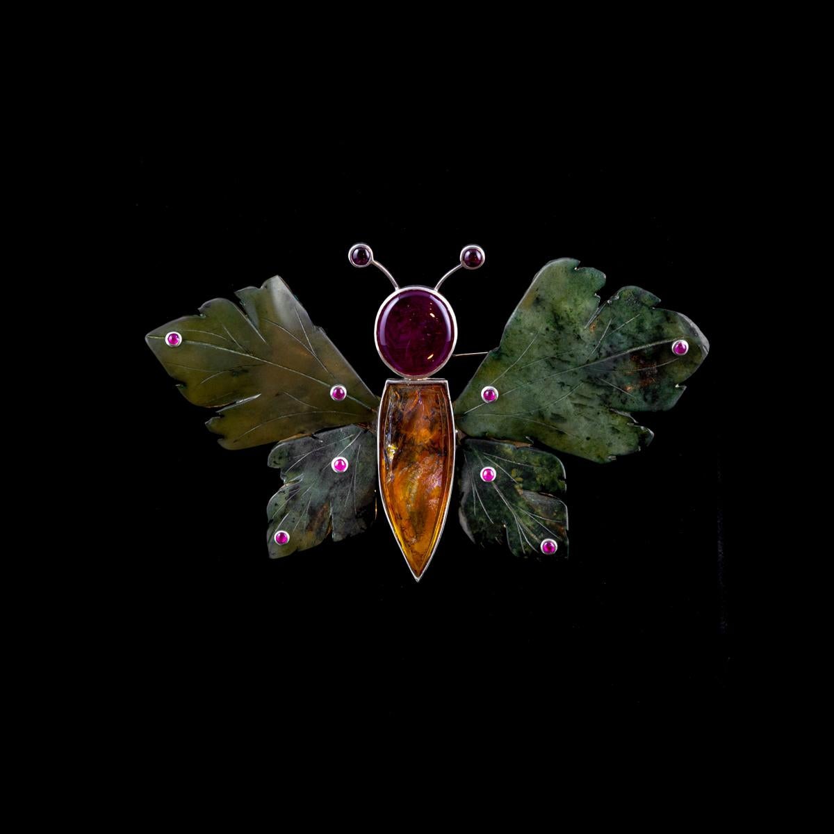 925 silver handmade butterfly shaped brooch created by our Italian goldsmith masters with green jasper, rutilated quartz, 36.20 ct cabochon ruby and 10 1.30 ct cabochon rubies. Contemporary shining and brightness inspiration with a touch of beauty.