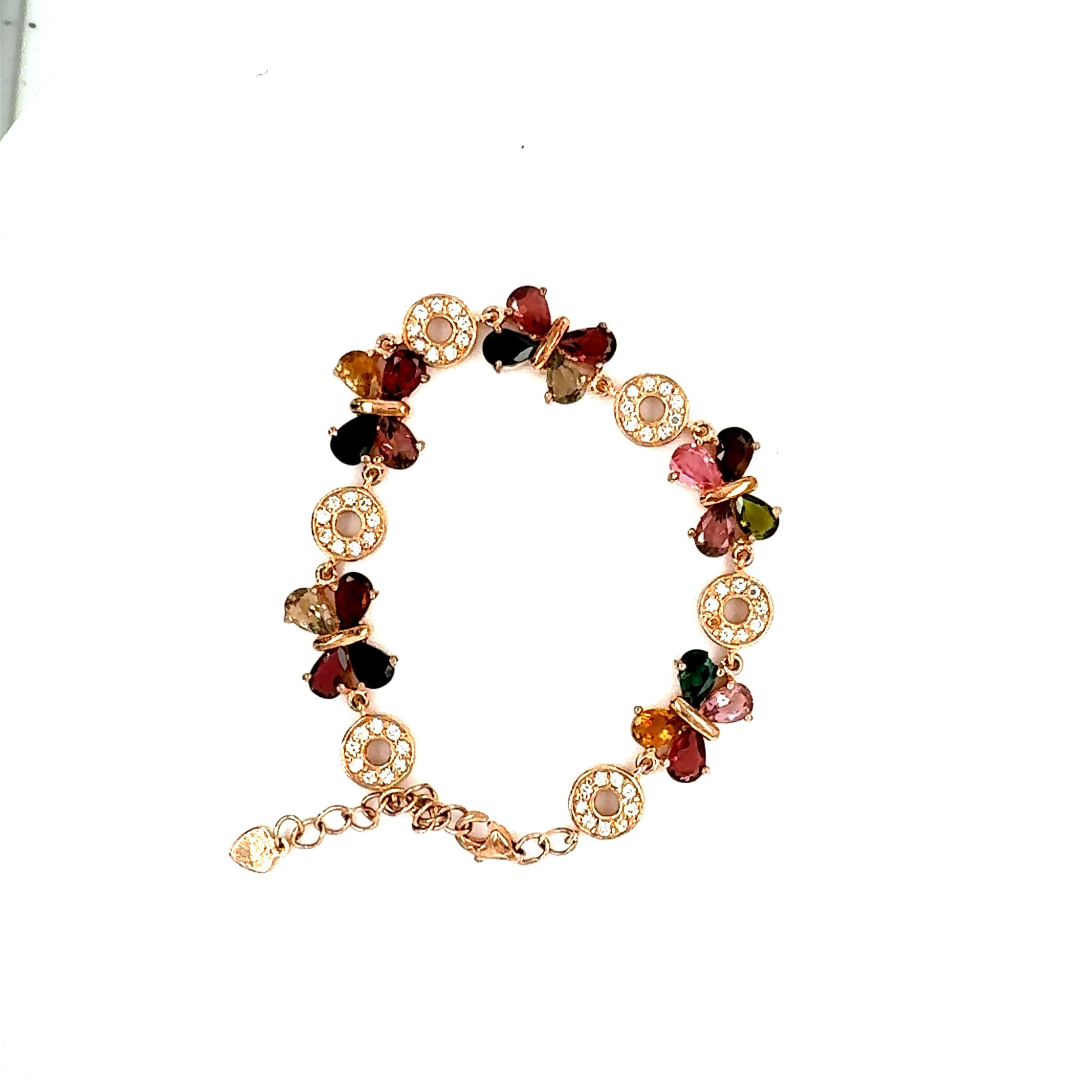 925 Silver Tourmaline and Cubic Zirconia Bracelet

Length of bracelet is 7 inches and comes with a lobster lock (Plating is done in a Rose color)