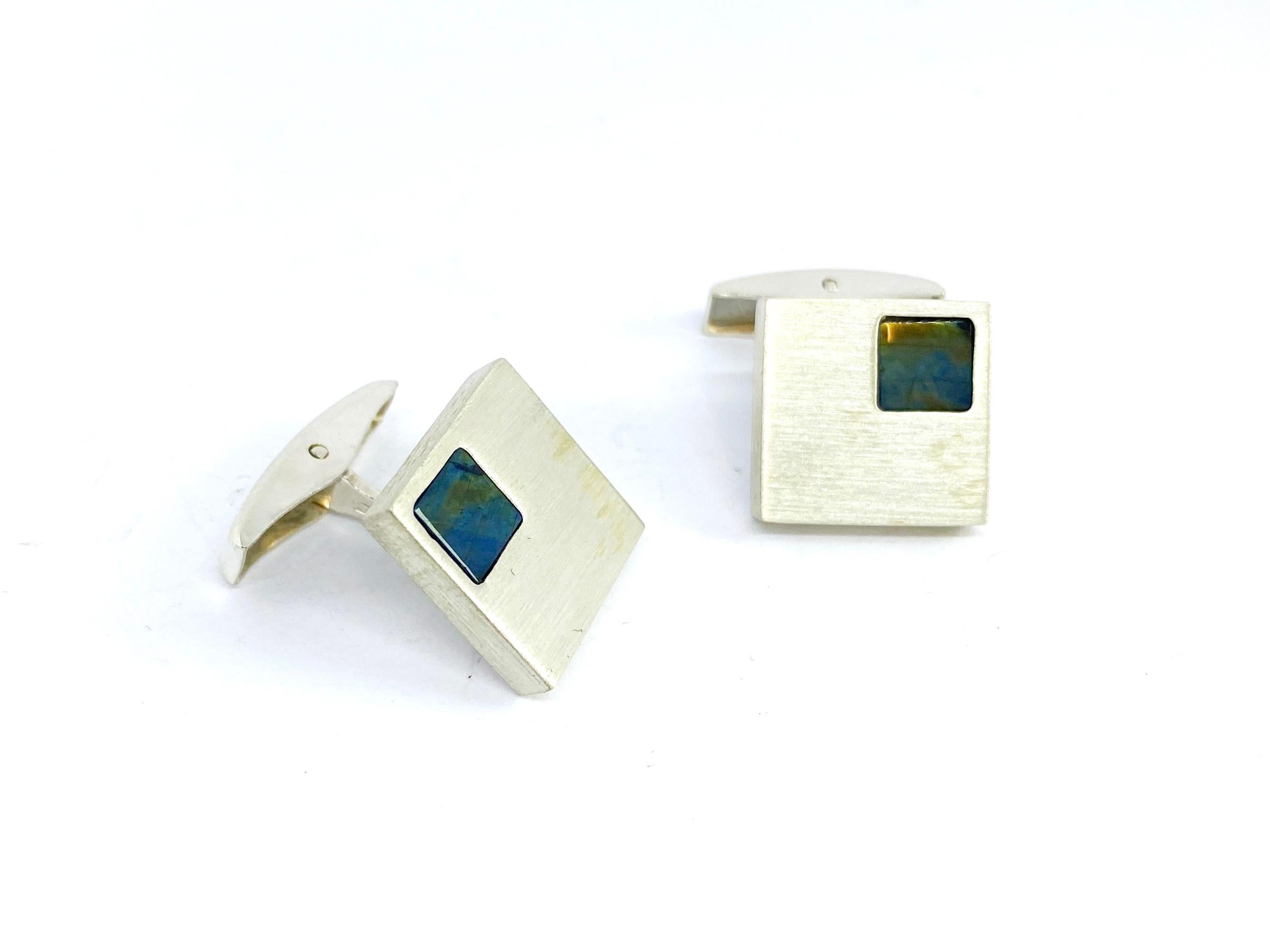 925 Sterling Finland Cufflinks Spectrolite

Unused new Cufflinks.
Stock of an old discontinued jeweler's shop.
Made 1994  Not polished,
Made Vaasa Finland.
Stamp JA =Johan Edvard Appelgren ?

Spectrolite Stone:
Due to its brilliant light effect in