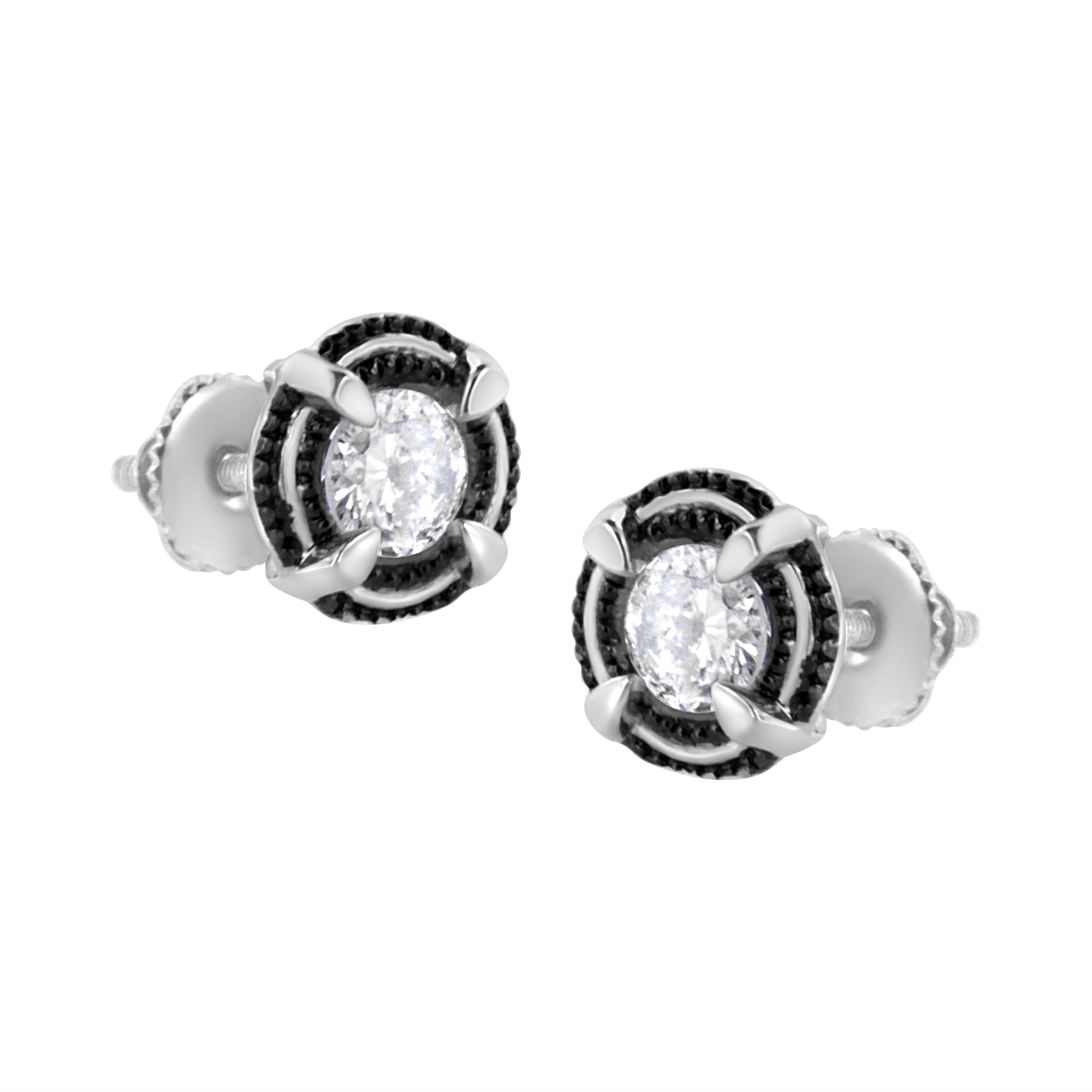 A modern classic, these gorgeous 92.5% sterling silver stud earrings feature round brilliant shape diamonds in a 1 1/2 Carat diamond total weight. These sparkling solitaire style diamonds are placed in the center of a raised double ring of milgrain