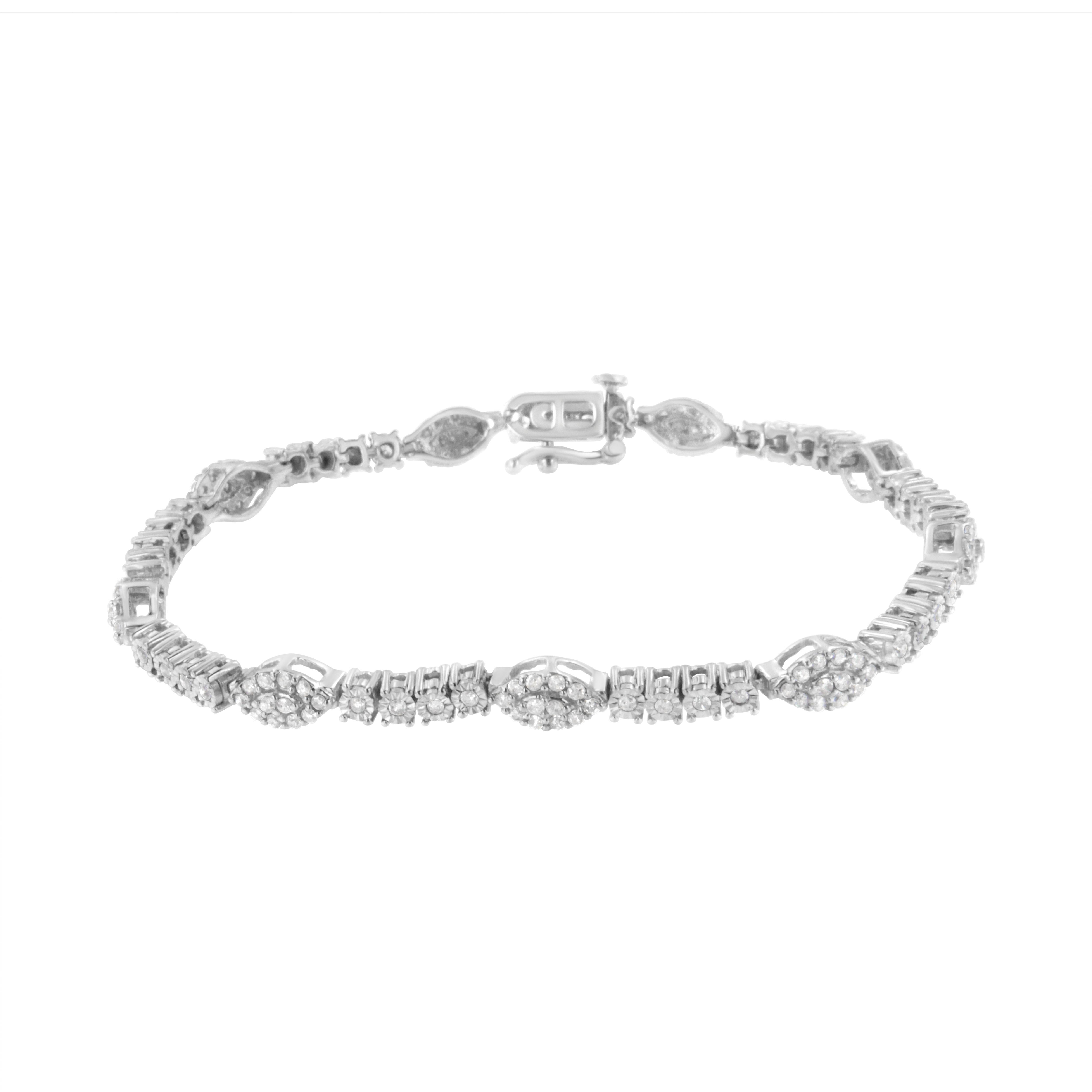 Four miracle set round cut diamonds connect with each other to create one of the links of this delicate tennis bracelet. Prong set round cut diamonds create an almond shaped cluster that alternates with the miracle set diamond chain to create this 1