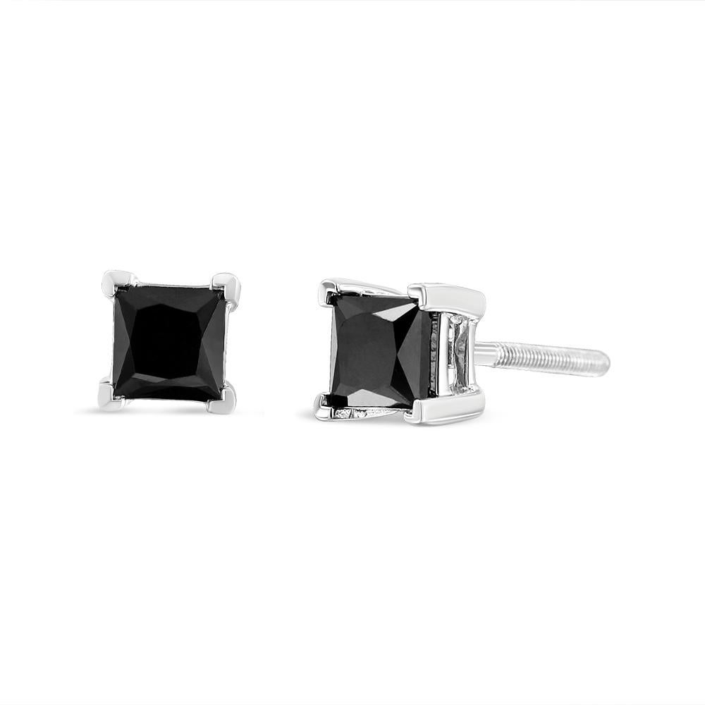 Elegant and timeless, these gorgeous .925 sterling silver solitaire stud earrings feature bold and beautiful heat treated, color enhanced black diamonds in a four prong setting. The earrings feature screwback closures. The notched posts and friction
