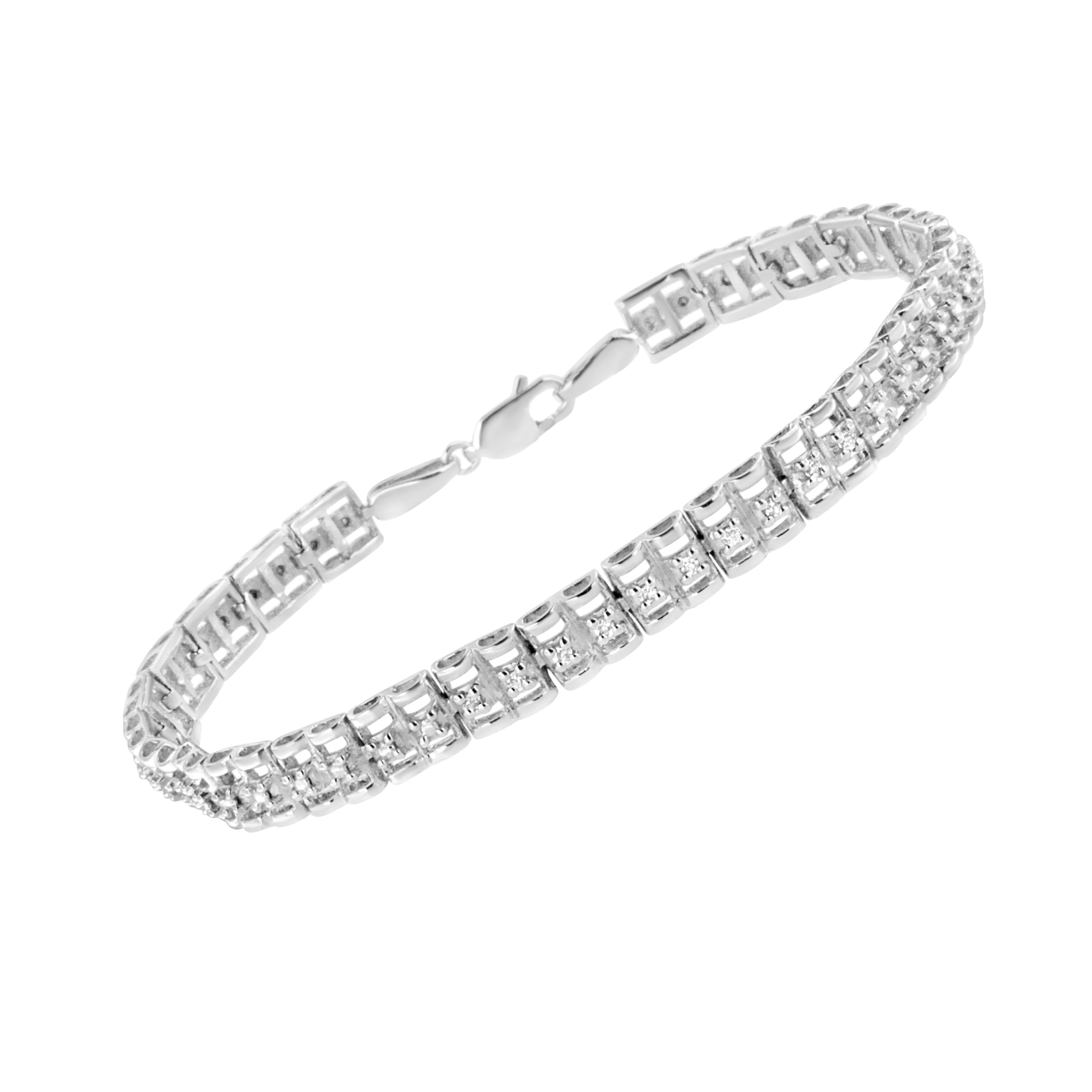 This lovely sterling silver bracelet features 1/10 cttw of beautiful, natural diamonds. The design of this piece features a repetitive pattern of vertical rows of a single round-cut, prong set diamond. This is a gorgeous and breathtaking gift for