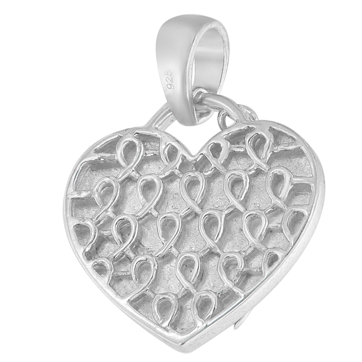 Adorn your neckline with timeless elegance. Crafted from .925 sterling silver, this pendant necklace features a heart-shaped design, symbolizing love and affection. Twelve natural, round-cut diamonds, totaling 0.10 cttw, adorn the pendant, radiating