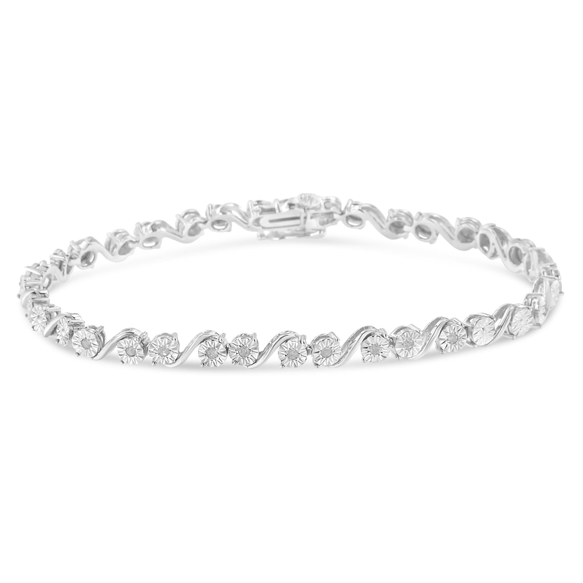 This link bracelet is the quintessence of beauty and elegance. It is crafted from the finest .925 sterling silver, and the miracle setting is embellished with 10 round cut, promo quality diamonds, which are on the lowest on the diamond color and
