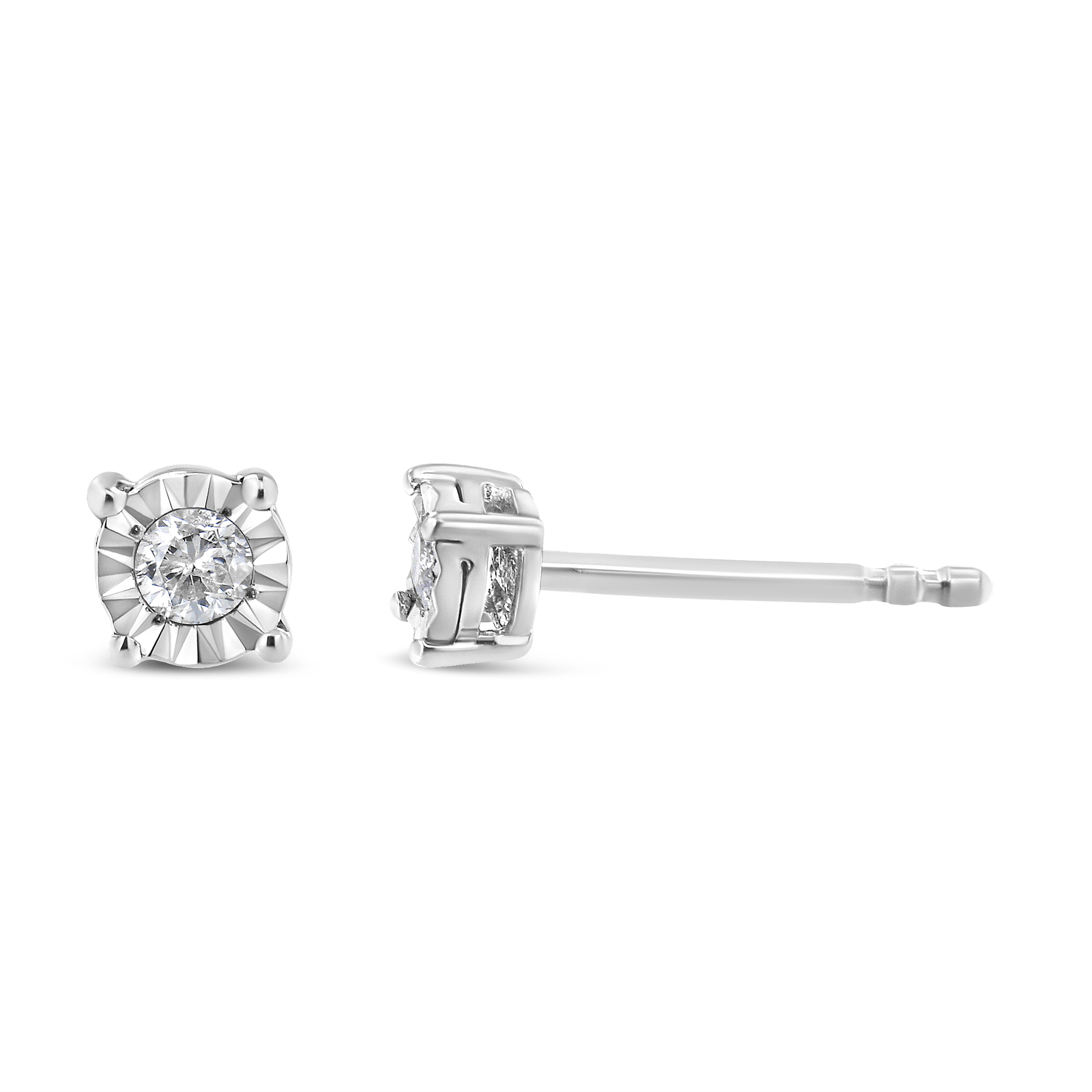 Add a shimmering touch to your wardrobe with these elegant and extravagant diamond earrings. Fashioned in the round shape, the earrings are crafted of sterling silver. Each of the studs captivates sparkling round cut diamonds, which gives the