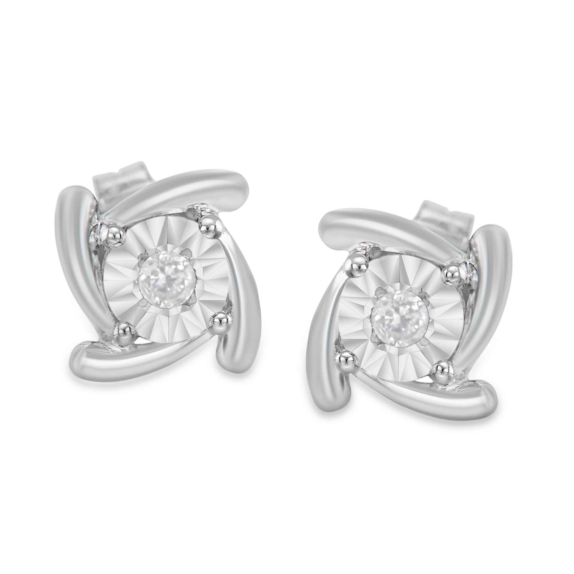 Elegant stud earrings made with .925 sterling silver and genuine diamonds. Each earing presents two diamonds with a round shape, brilliant cut and a miracle setting. This fine jewelry item has a 1/10 carats of total diamond weight and a concentric