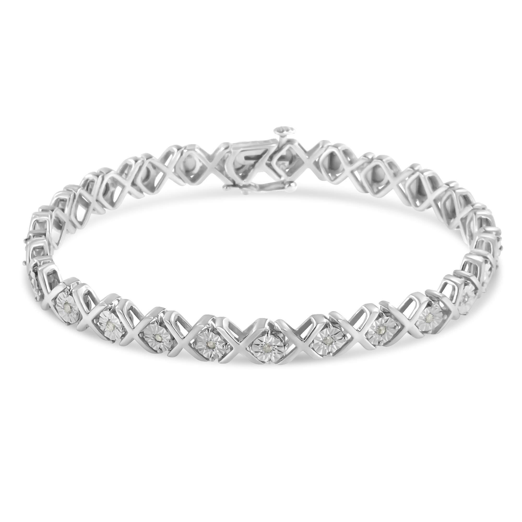 A gorgeous sterling silver diamond accent tennis bracelet, perfect for your jewelry collection. This stunning piece is designed with a pattern of round-cut diamonds embellished in a miracle setting, separated by sterling silver 