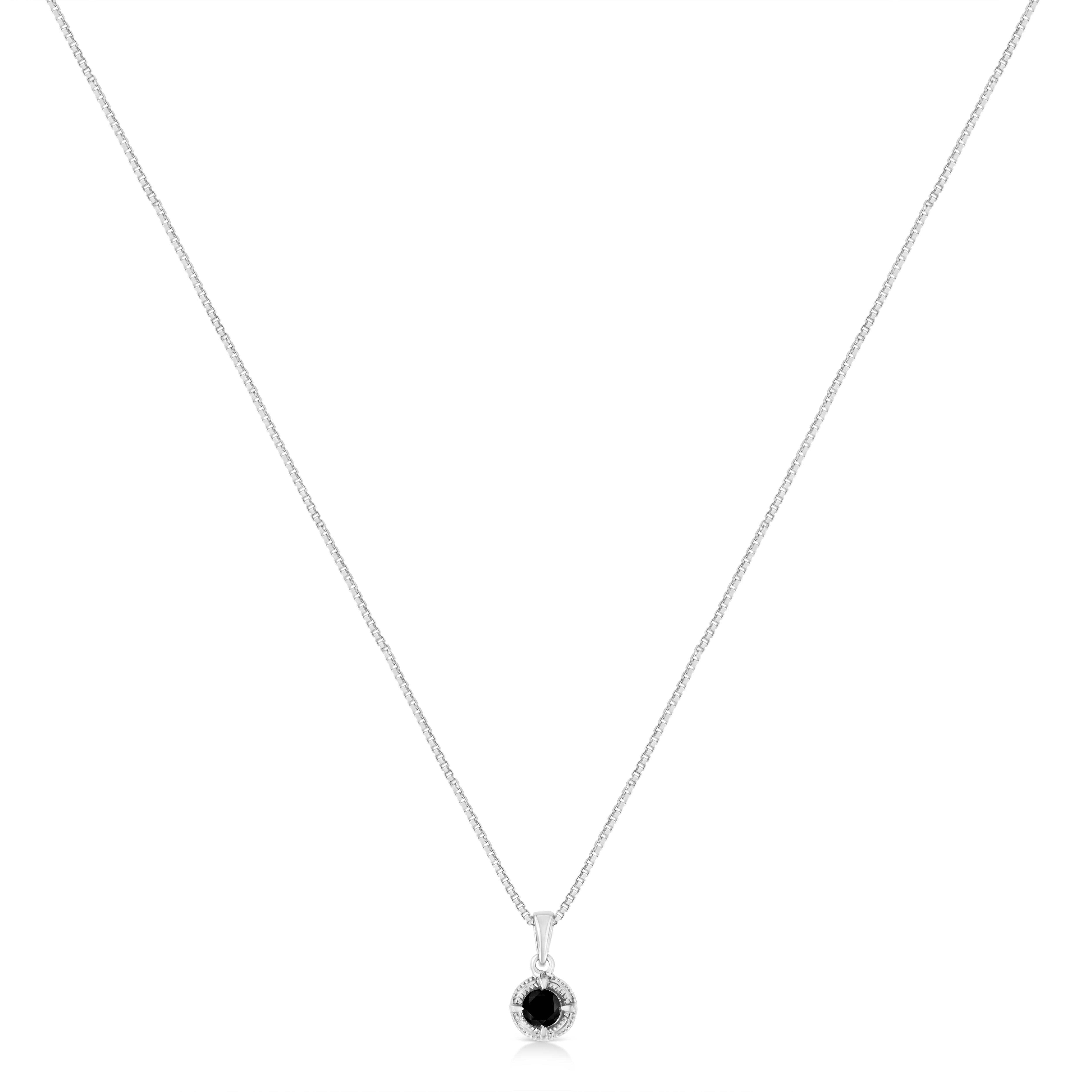 Some things should be reinvented, which is why we created this twist on the solitaire diamond necklace. This unique solitaire diamond necklace features a single treated black diamond which is 4 Prong set in a .925 Sterling Silver setting. This round