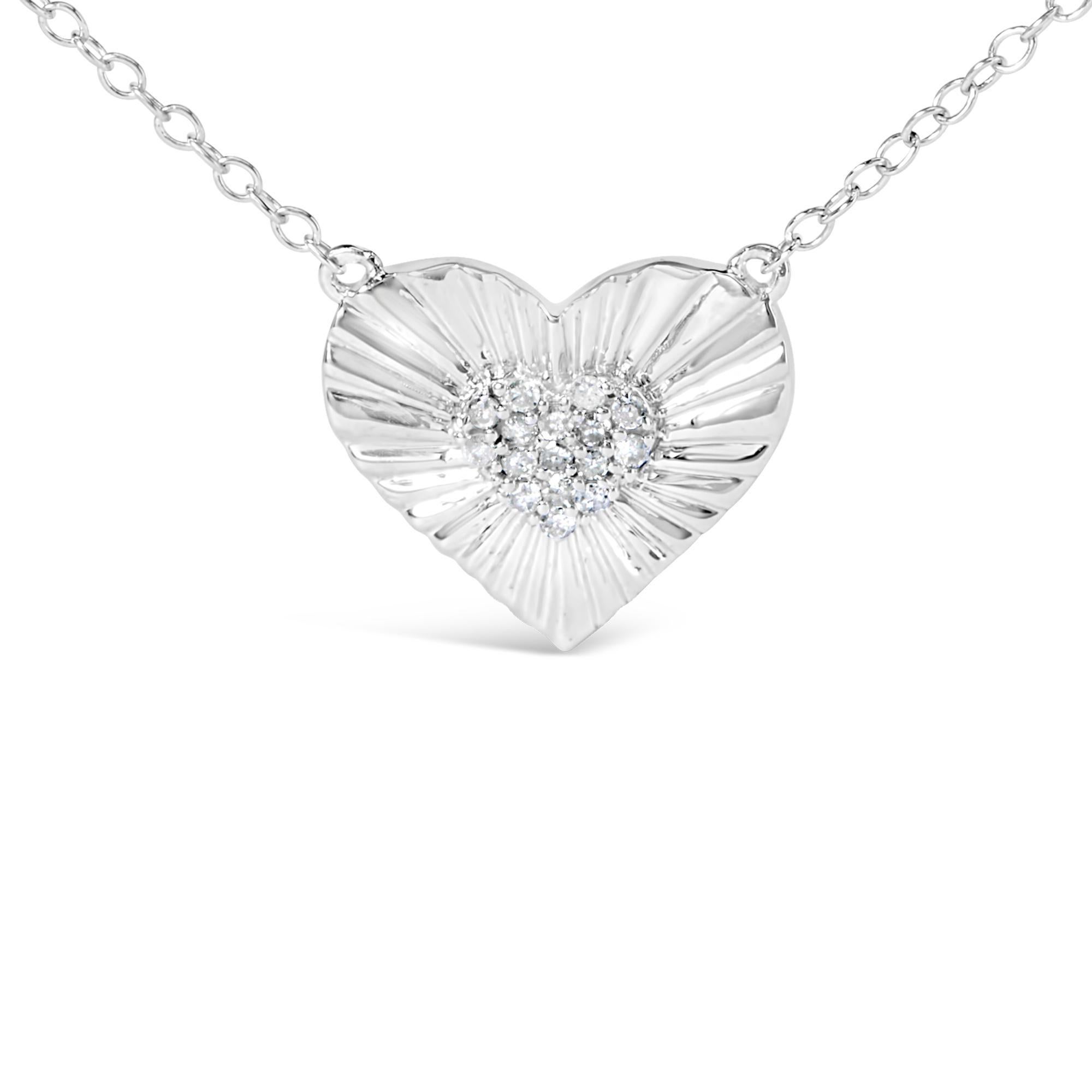 Unveil your inner light with this enchanting .925 sterling silver heart pendant necklace, rhodium-plated to ensure a mesmerizing luster that reflects as deeply as your emotions. At its core, a delicate cluster of natural diamonds sparkles with the