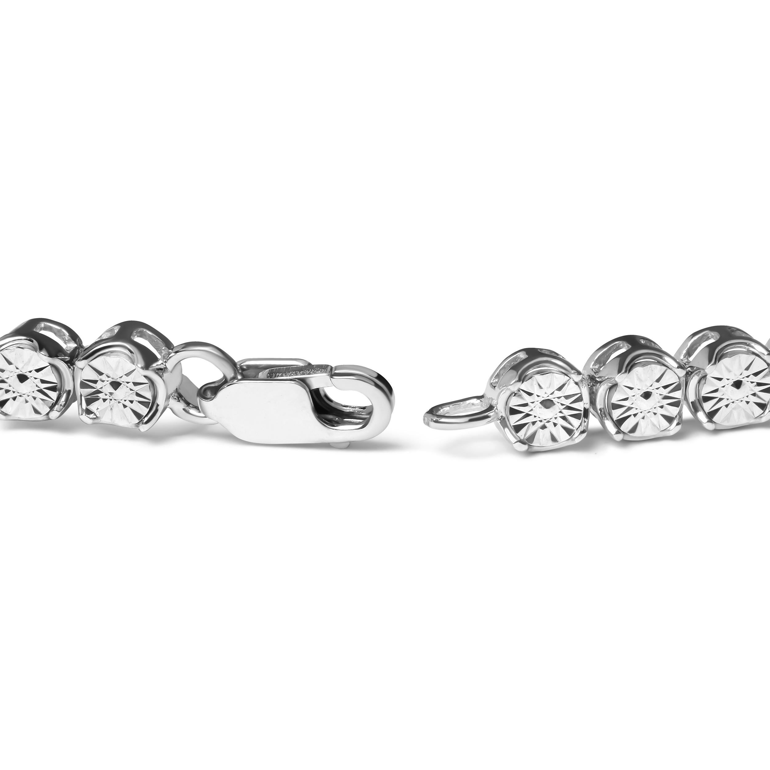 Indulge in the luxurious sparkle of diamonds with this breathtaking sterling silver tennis bracelet. Expertly crafted from .925 sterling silver, this bracelet showcases 10 natural round cut diamonds in a brilliant miracle setting. The diamonds boast