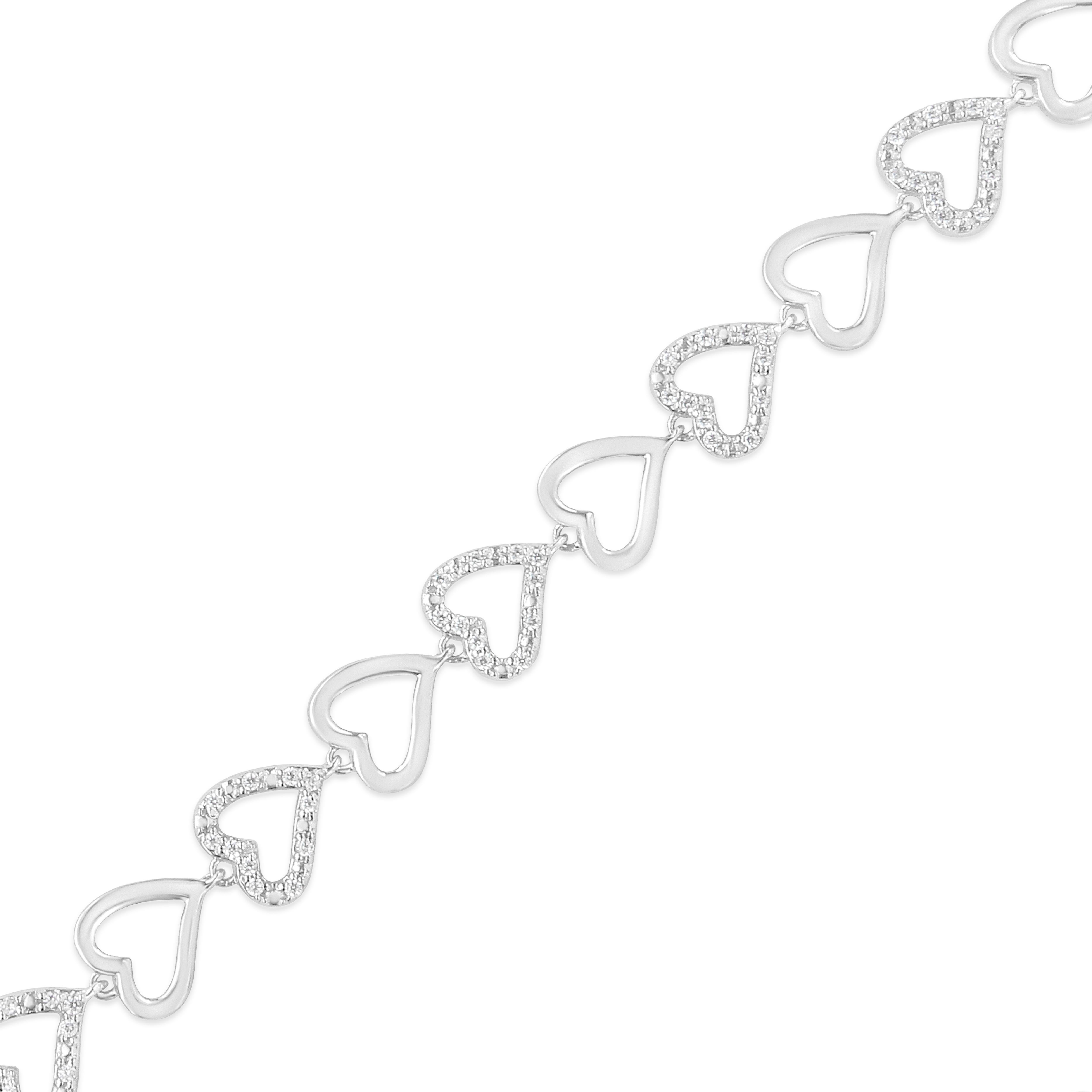Trendy and sweet, this 1/2 cttw bracelet is designed with alluring silver heart links that will delicately rest on your wrist. This bracelet is crafted in the finest .925 sterling silver, and plated with rhodium (a platinum-family metal) for a