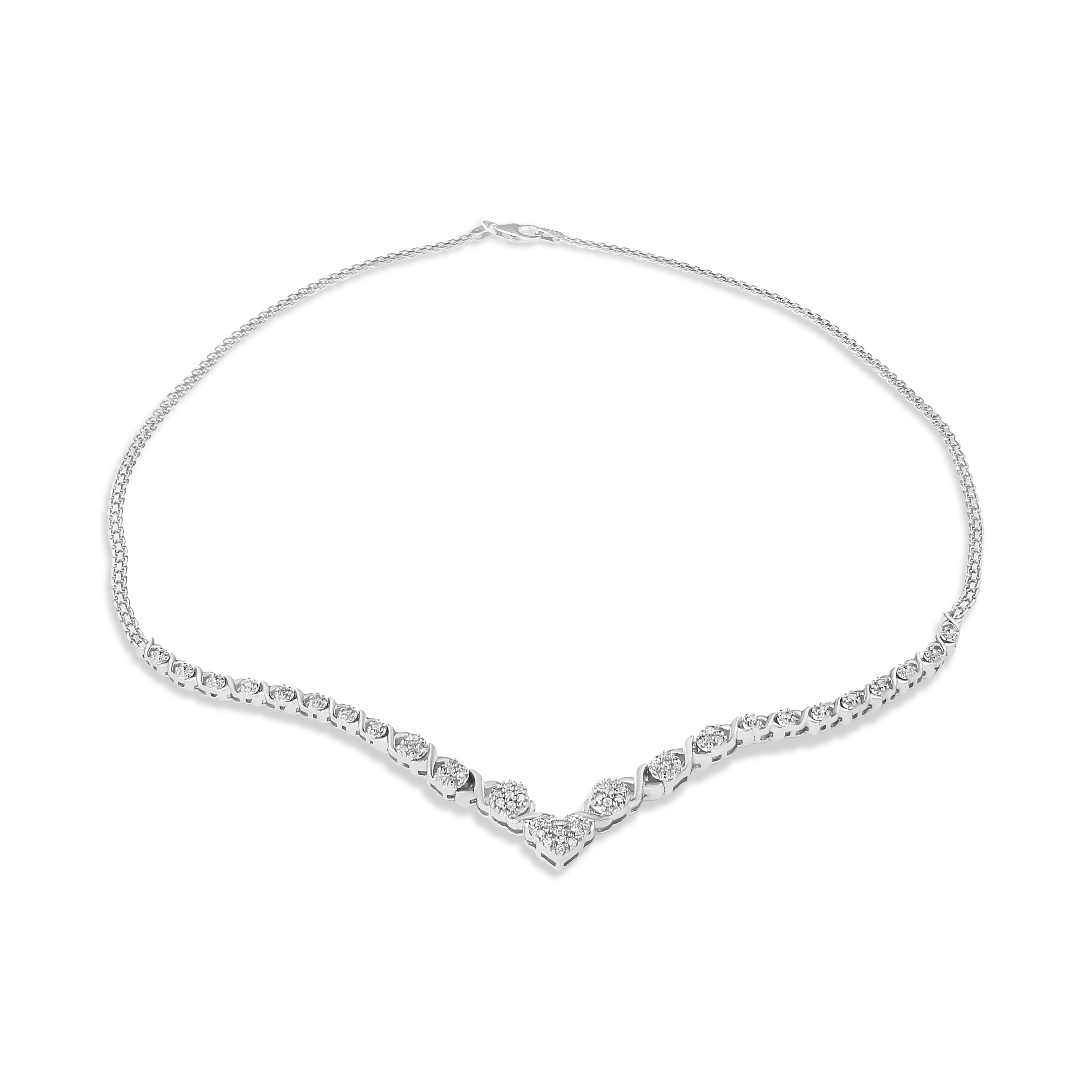 A uniquely elegant diamond cluster necklace. Each diamond is set to create a captivating V-shaped base with an attached 18 inch box chain. There are 52 rose-cut diamonds set in the finest .925 sterling silver metal.
The diamonds are promo quality,
