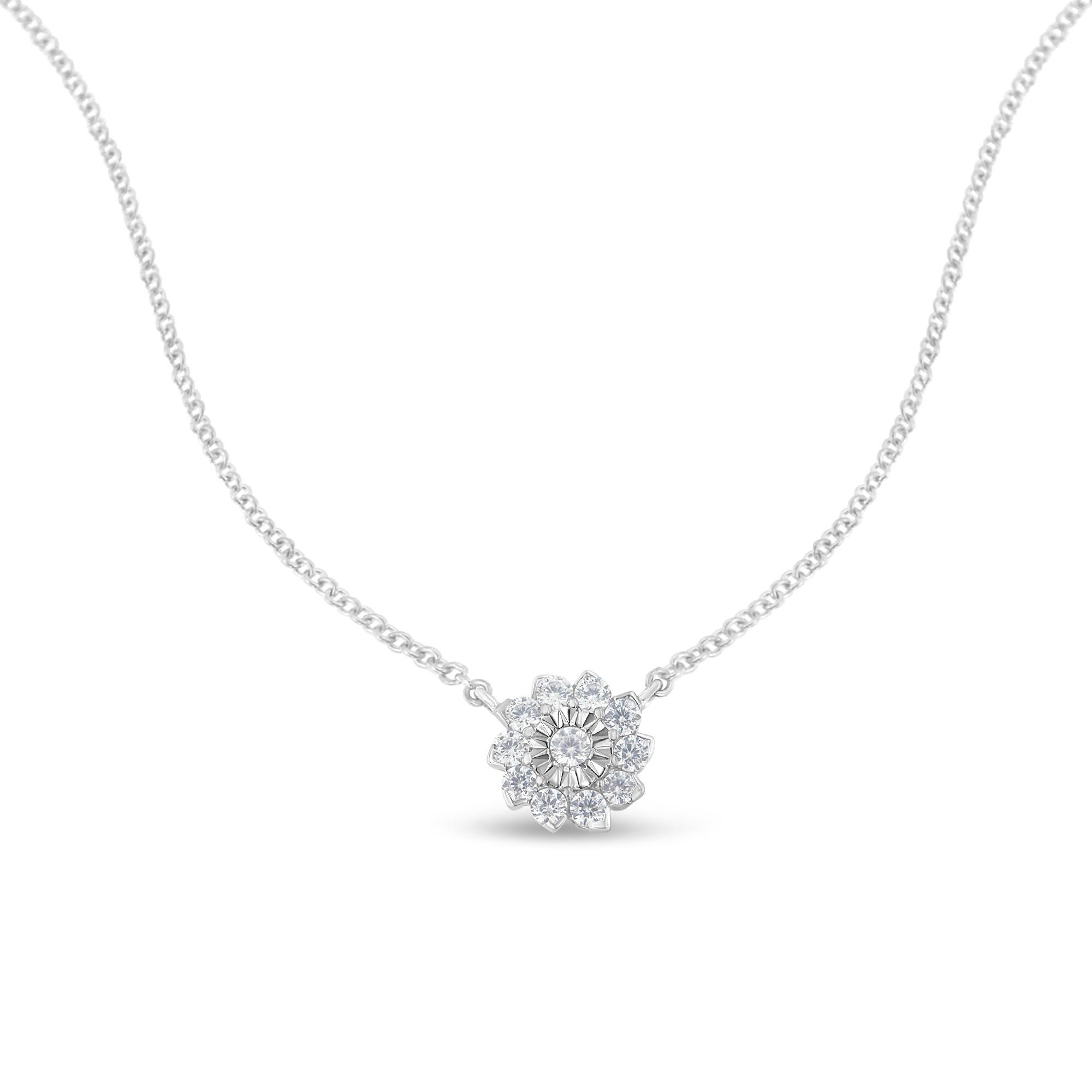 This dazzling diamond floral pendant is fashioned of stunning sterling silver. It features .50CTW of round brilliant diamonds that are clustered together around a single miracle set diamond to form a lovely flower with a grand look. This pendant is