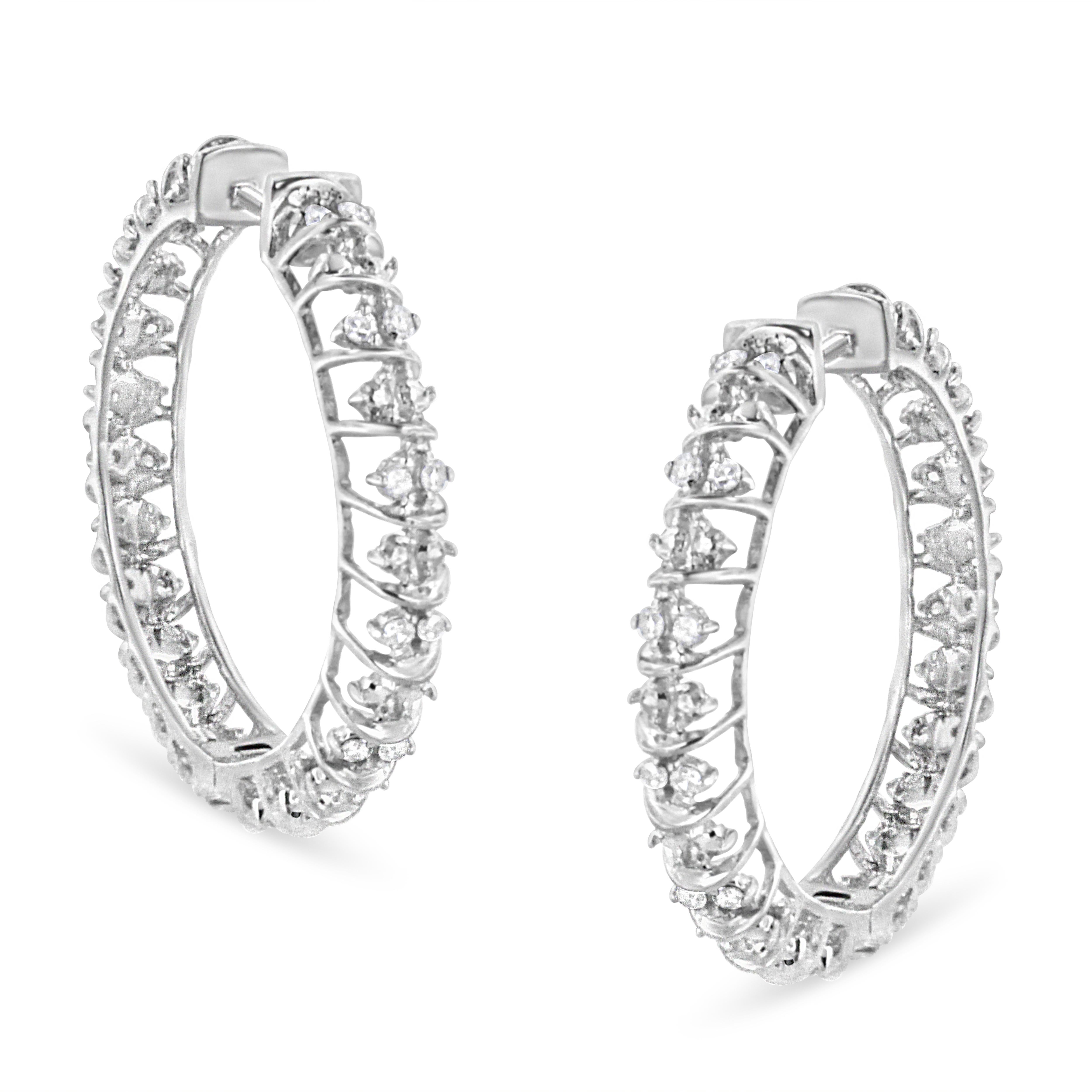 Hoop earrings will always have a special place in our hearts, but this pair takes it to the next level. They feature a cage-like design in .925 Sterling Silver that holds 44 round natural diamonds in a prong setting that total up to 1/2 carat