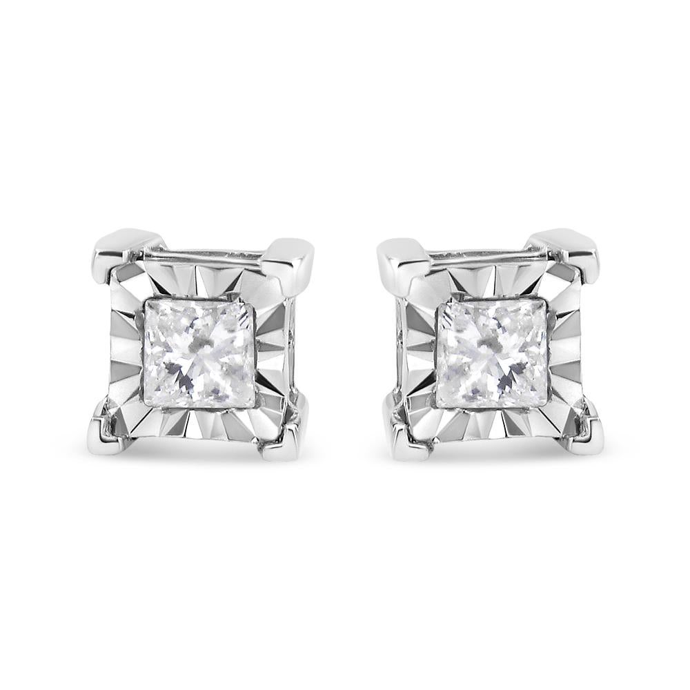 These earrings are a must have for every woman. These fabulous princess cut diamond earrings are crafted in the finest .925 sterling silver, plated with rhodium (a platinum-family metal) for a lifetime of tarnish-free wear.. Each stud showcases a