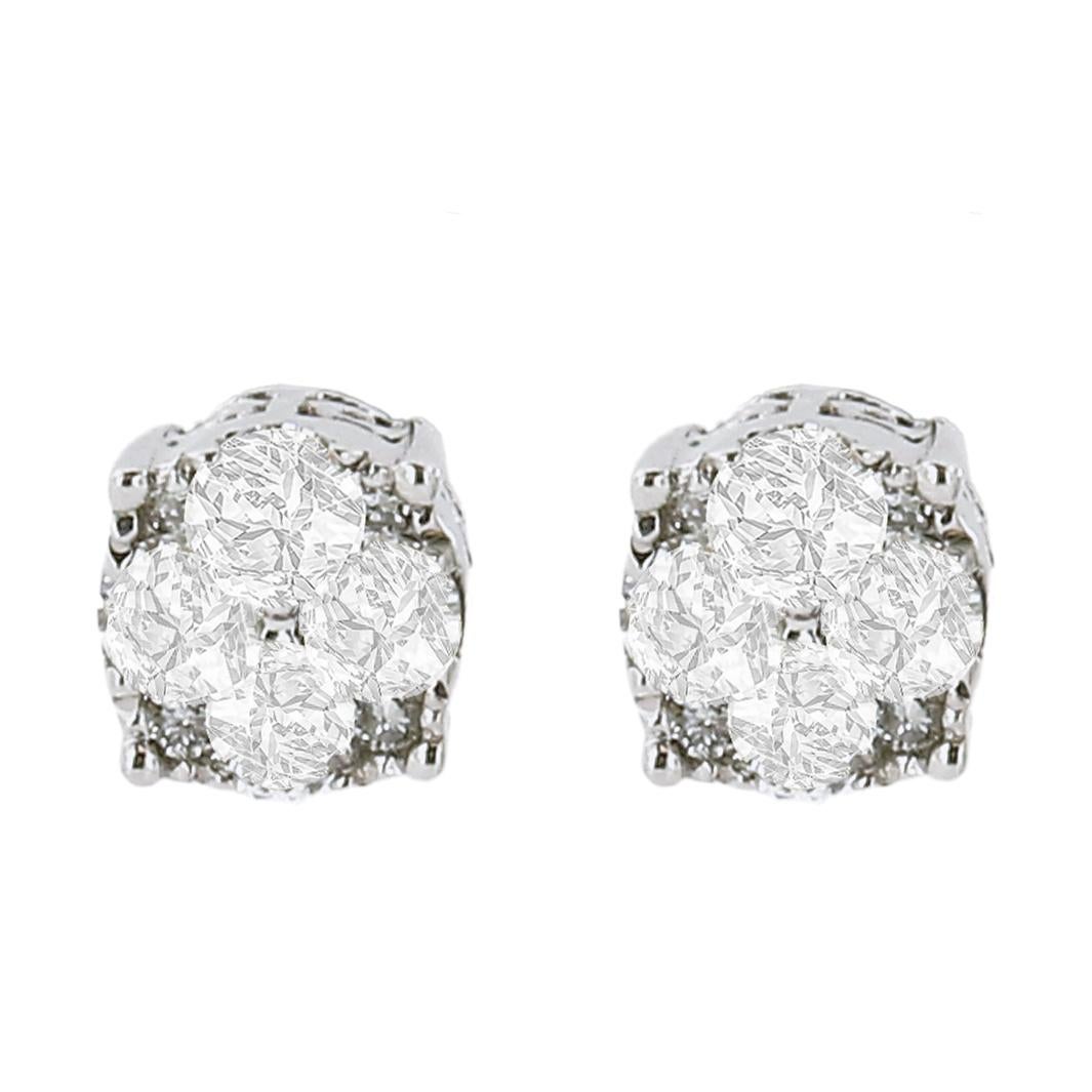 You will love these sterling silver stud earrings. Two sizes of round cut diamonds come together in this design to create a circular diamond cluster that captures the light from different angles and gives a unique shine. The sides of the earrings