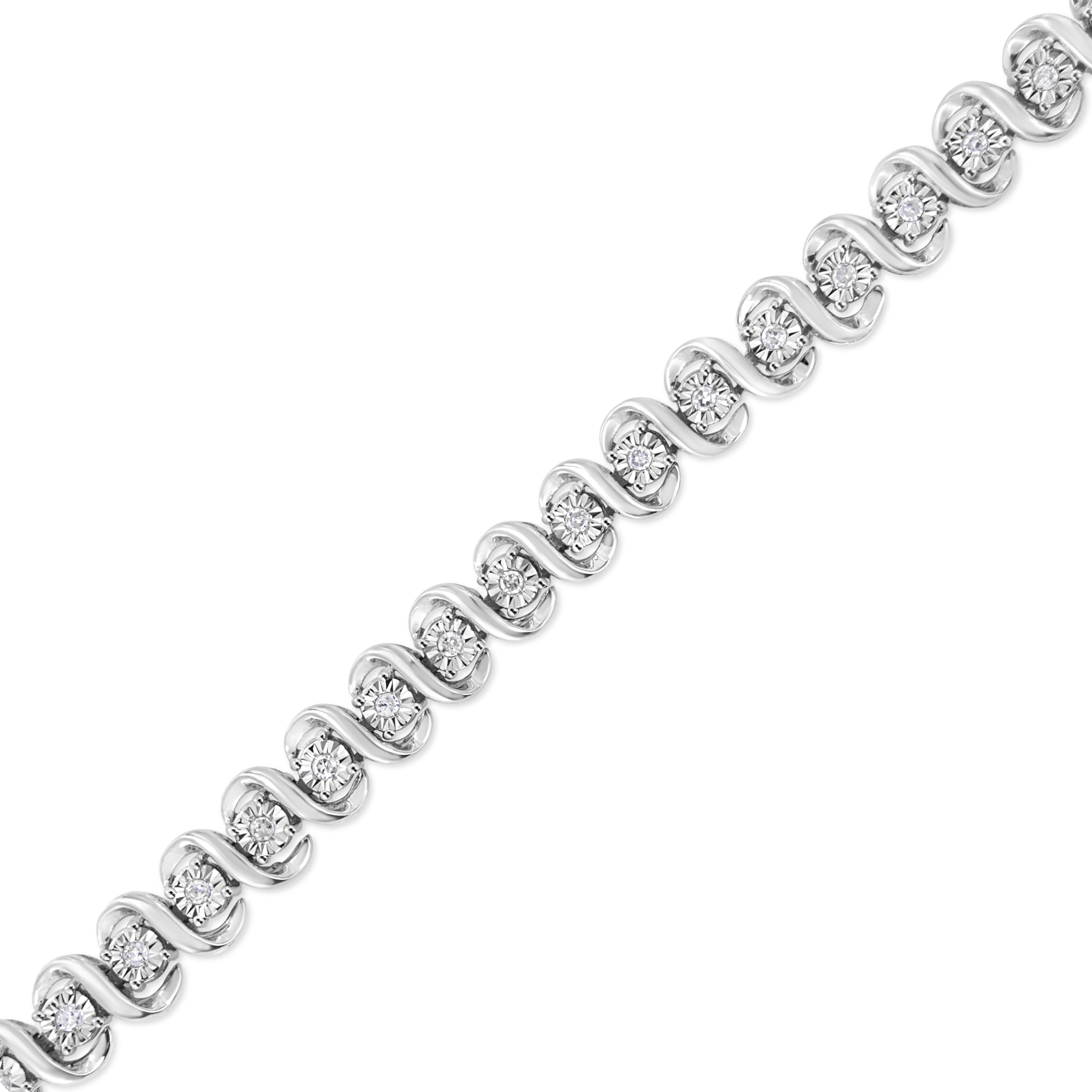 Add a touch of glamour to your everyday wear with this beautiful 1/2 cttw diamond bracelet. This piece has an elegant design of silver 