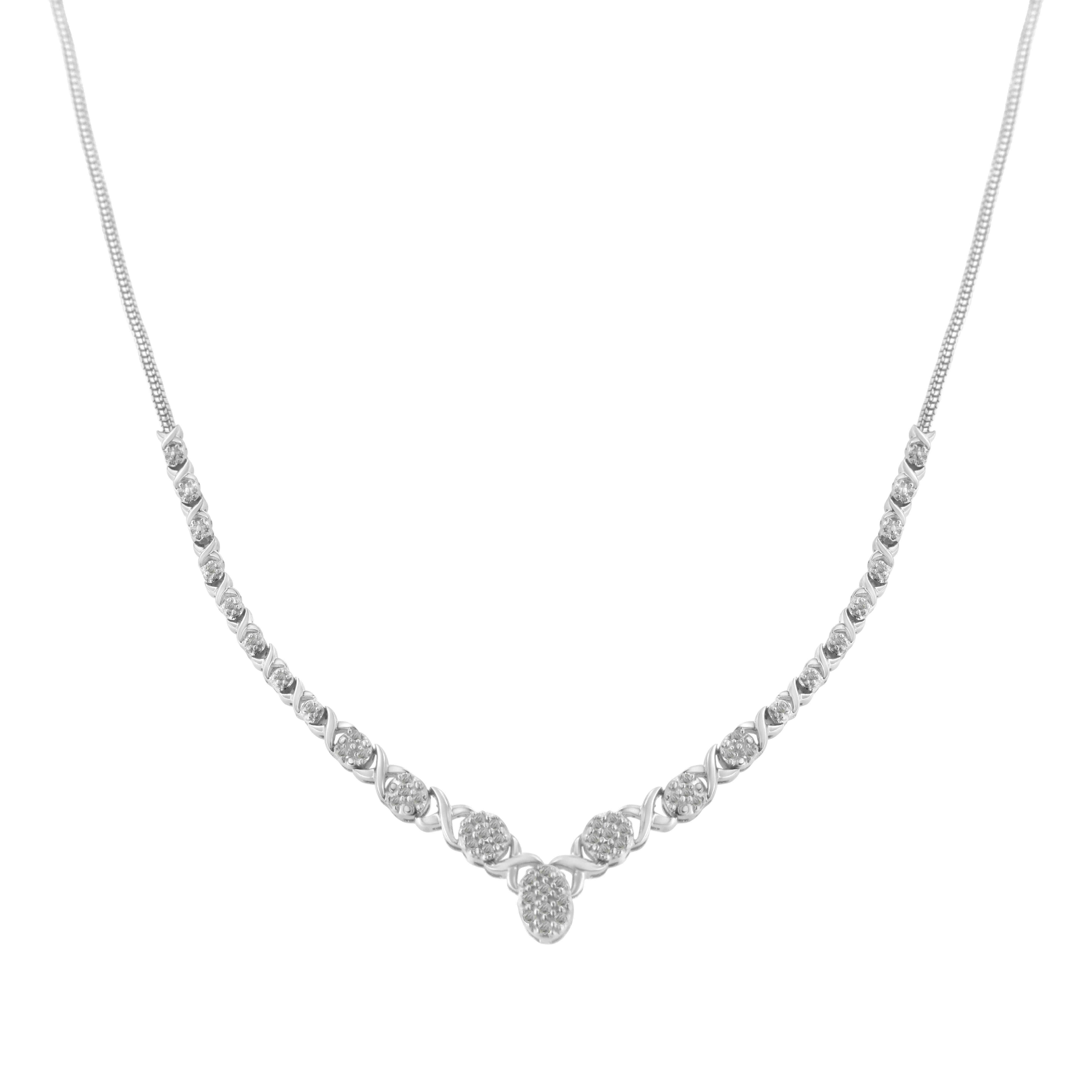 An elegant and breathtaking cluster diamond necklace. Each diamond is perfectly placed to create a beautiful V-shaped piece that is crafted in the finest .25 sterling silver. There are 48 natural diamonds, each set in a prong setting. The diamonds