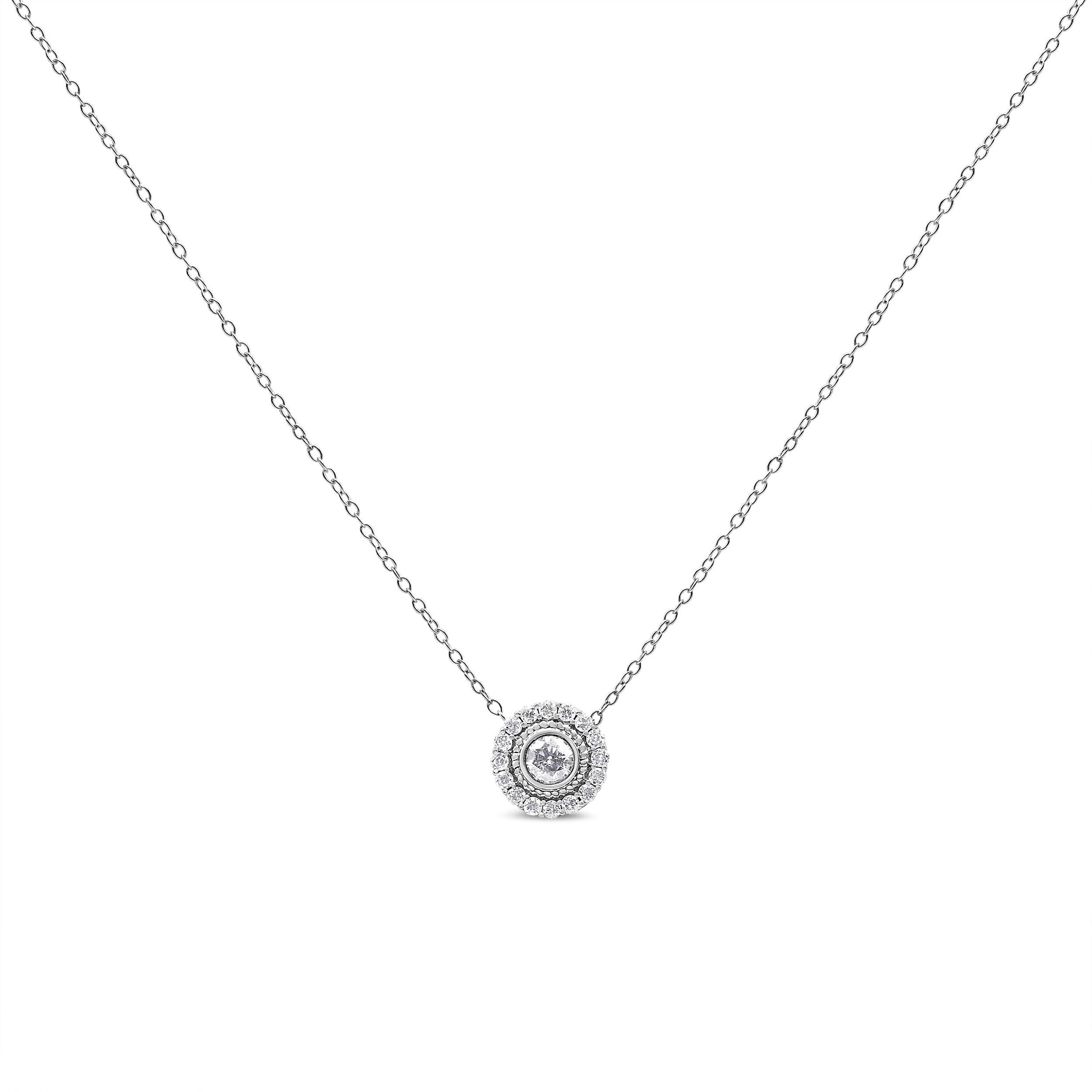 Strike a pose in this alluring diamond halo circle pendant necklace crafted of .925 sterling silver. This piece is a classic beauty, creating instant intrigue with a gorgeous center diamond  nestled in a bezel setting, surrounded by a halo of