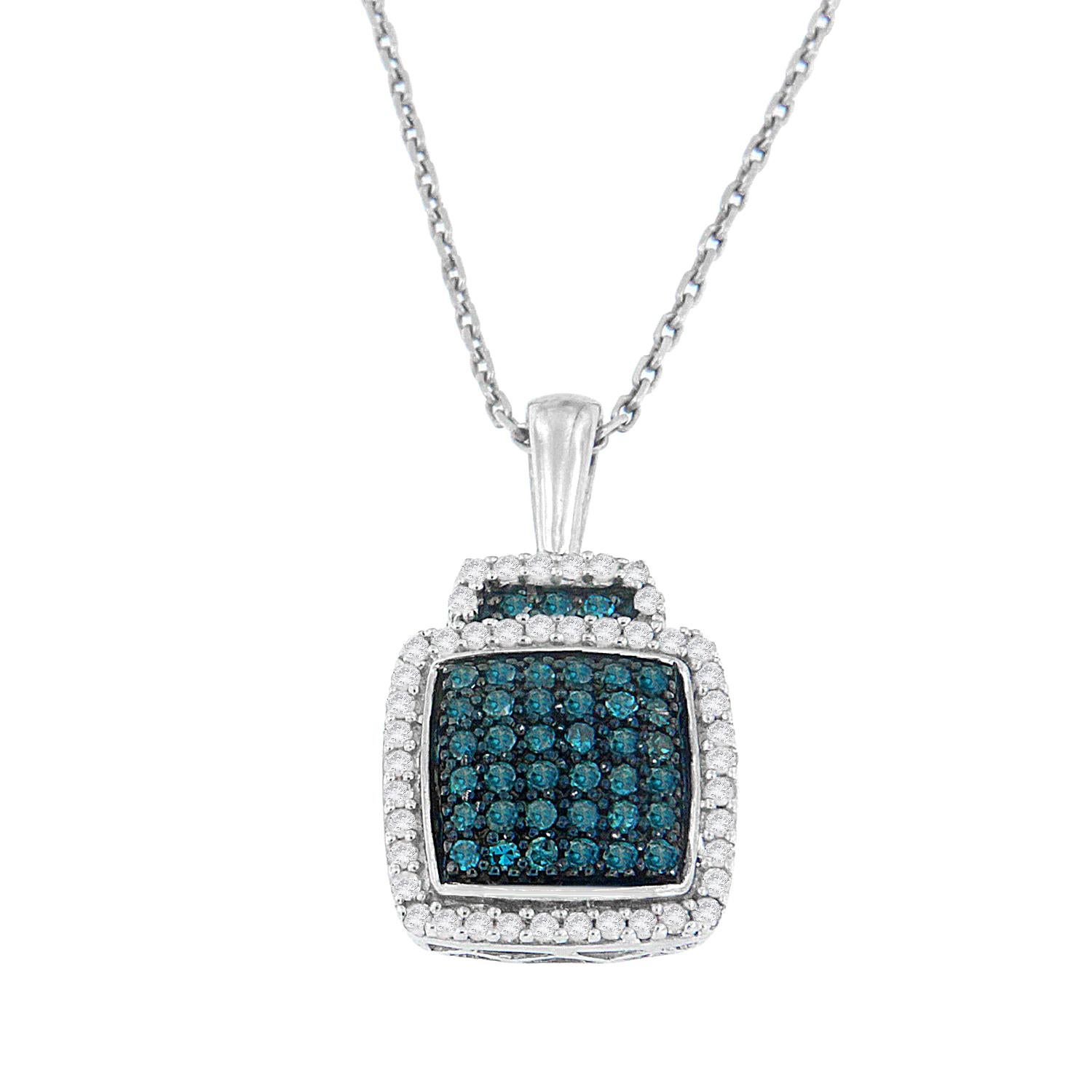 Set in a square shaped basket design and adorned with filigree details on the sides, this diamonds pendant is a true statement piece. A center cluster of deep blue, color treated, round cut diamonds sparkle inside a dazzling halo of white round