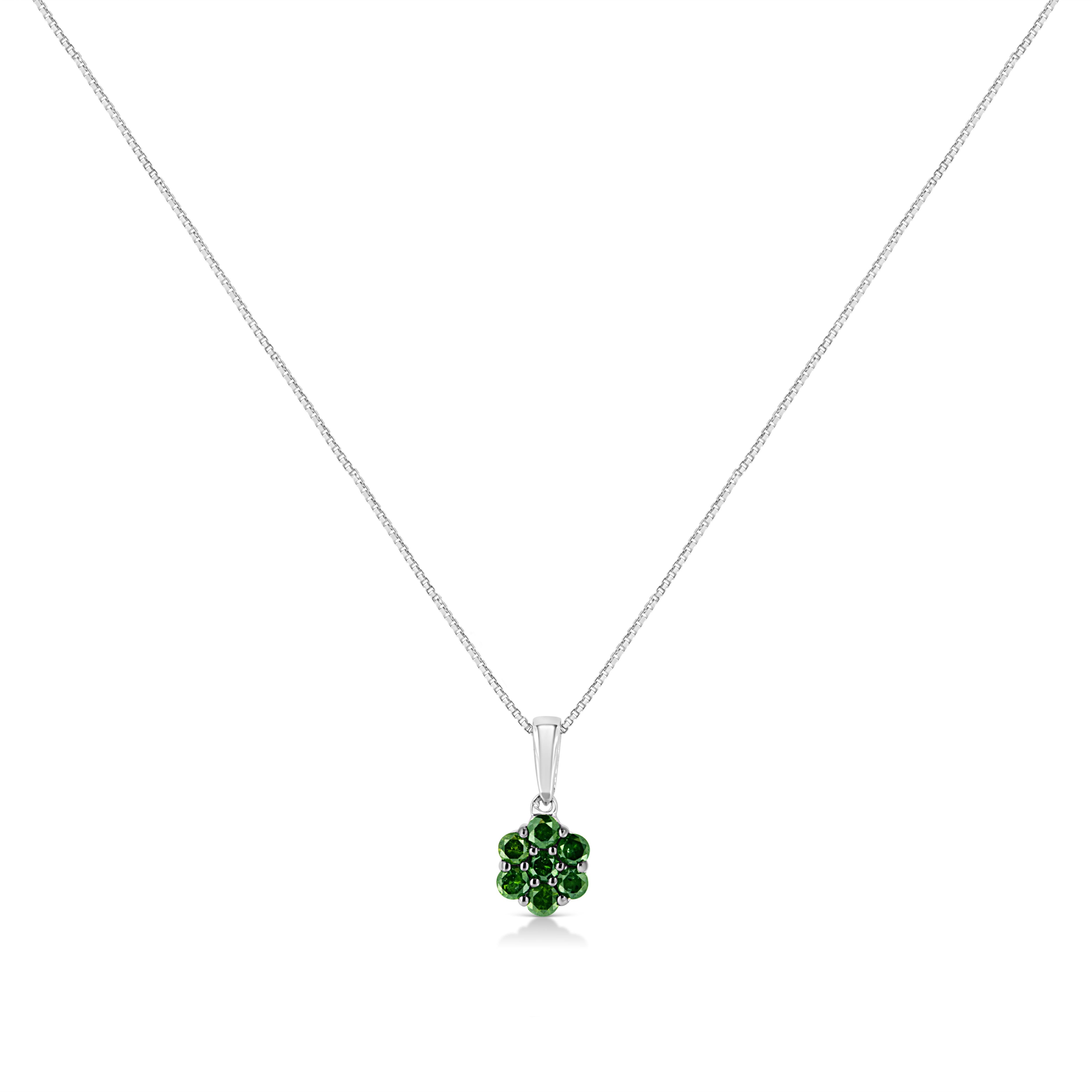 This gorgeous floral diamond cluster pendant will shine on your neck. Fashioned in the finest .925 sterling silver, this necklace gleams with 7 treated green diamonds in an elegant setting. The diamonds are round-cut and prong set with a total carat