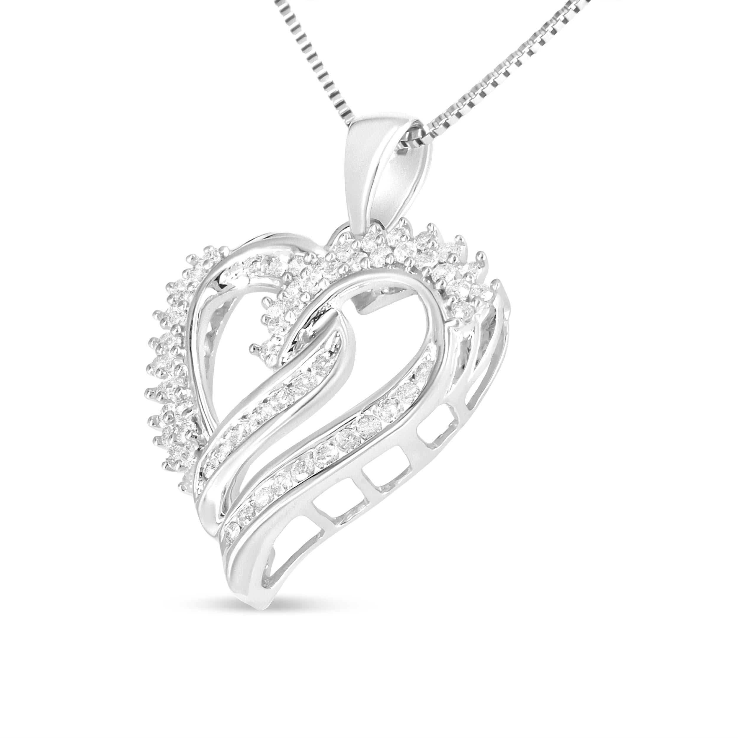 This heart pendant necklace speaks volumes of your love that features rows and loops of shimmering diamonds that beam bright rays of sparkle. The .925 sterling silver casts a ribbon-like silhouette with sculpted loops. The delicate, graceful outline