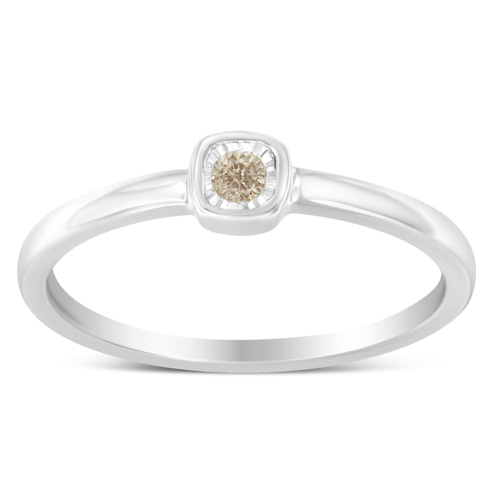 A classic look for the classic girl. Fashioned in stunning sterling silver, this promise ring features a shimmering .05 ct. round diamond solitaire in a unique miracle plate setting for maximum sparkle. The diamond is set in a square shape setting