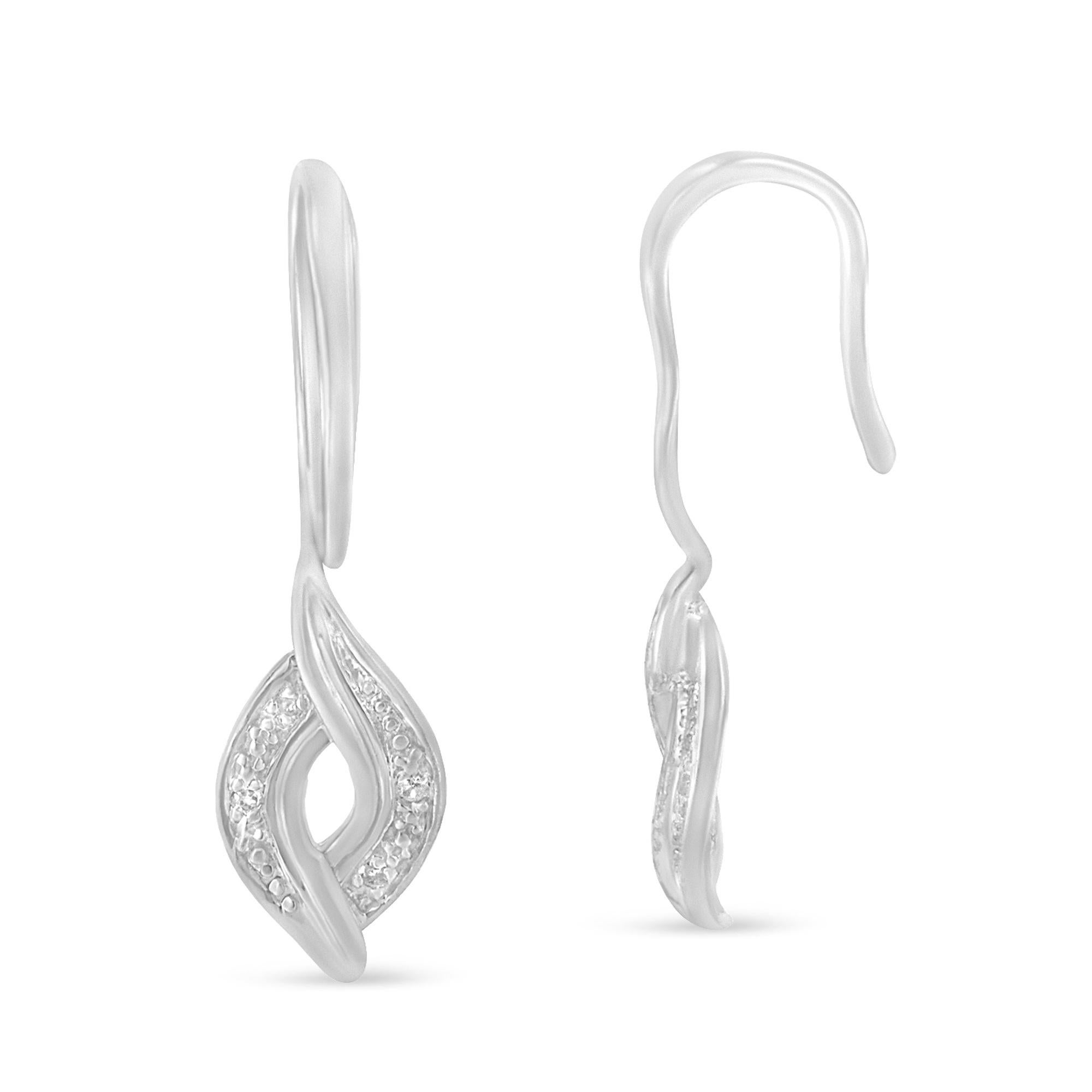 Upgrade your party look with these gorgeous dangle earrings. Polished high to shine, the earrings are composed of sterling silver. Designed in a unique shape, the earrings are embellished with round cut diamonds that are arranged in a prong setting.