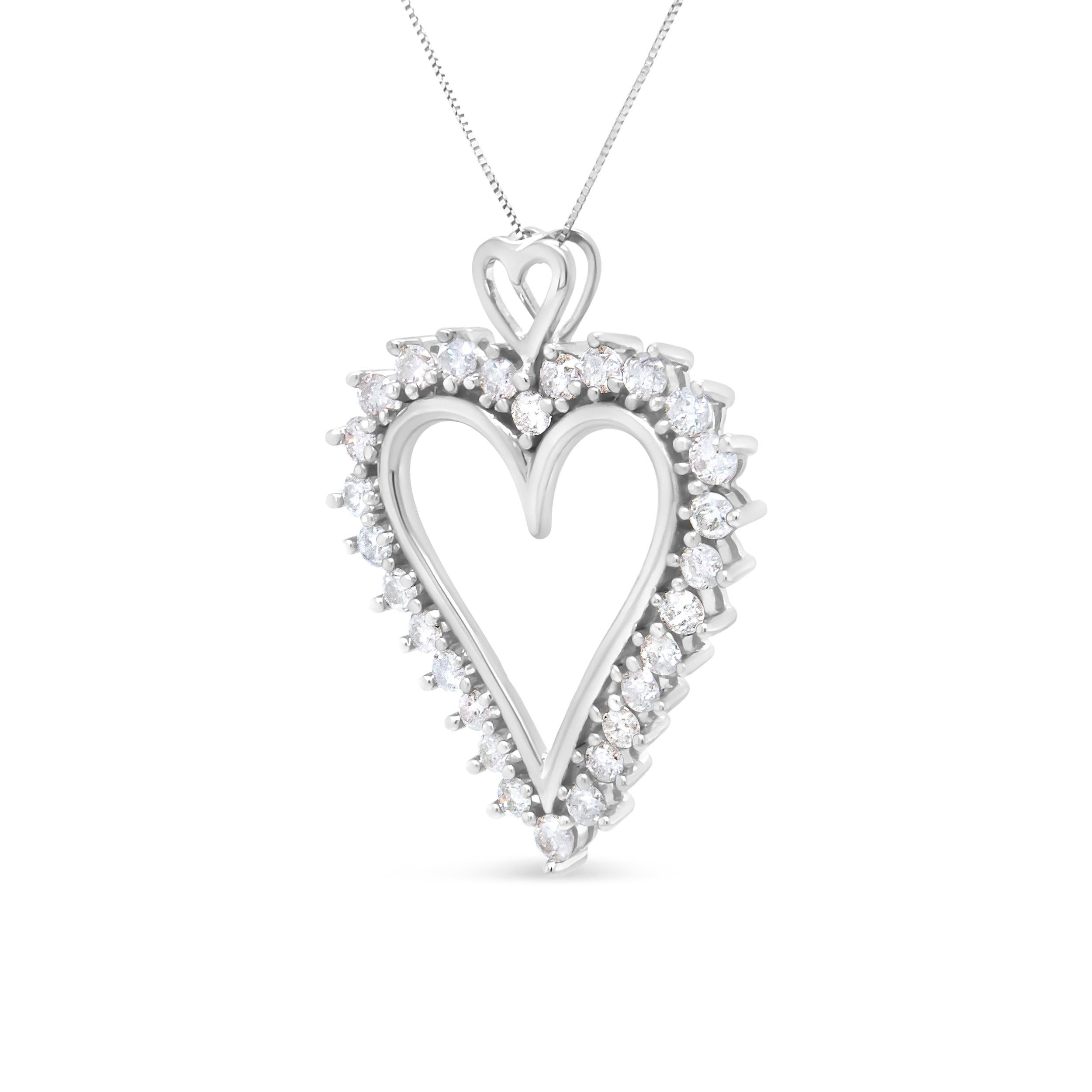 This ravishing .925 sterling silver necklace is a true romantic, shaped in an openwork heart and studded with round diamonds in prong settings. These shimmering white diamonds total 1 3/4 cttw with an approximate I-J color and I2-I3 clarity. The