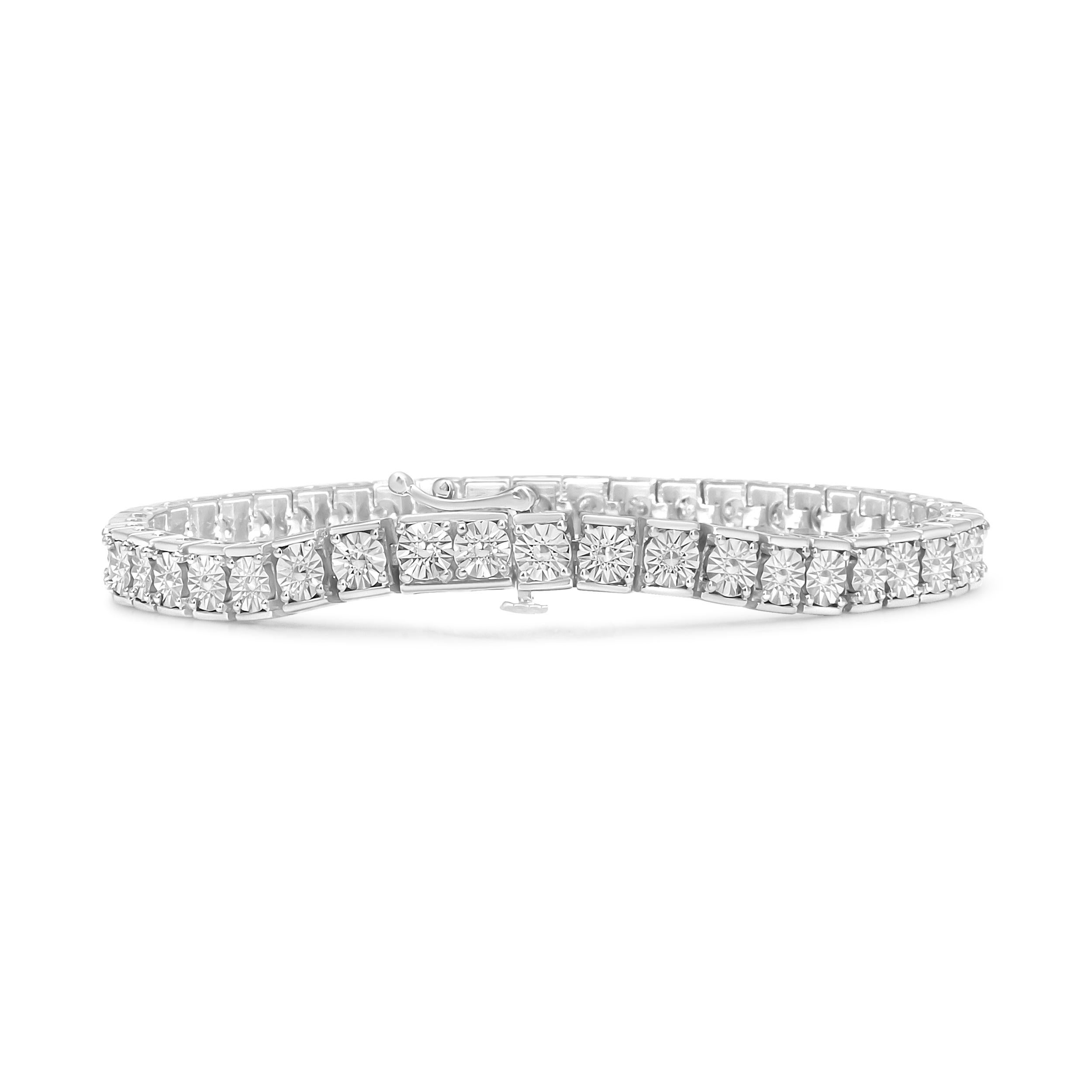 When it comes to jewelry, the classic diamond tennis bracelet is fail-proof. Highlighting 24 natural round diamonds in a miracle setting that total up to 1/4 cttw, the Sterling Silver piece is truly a versatile pick for any occasions, from a day