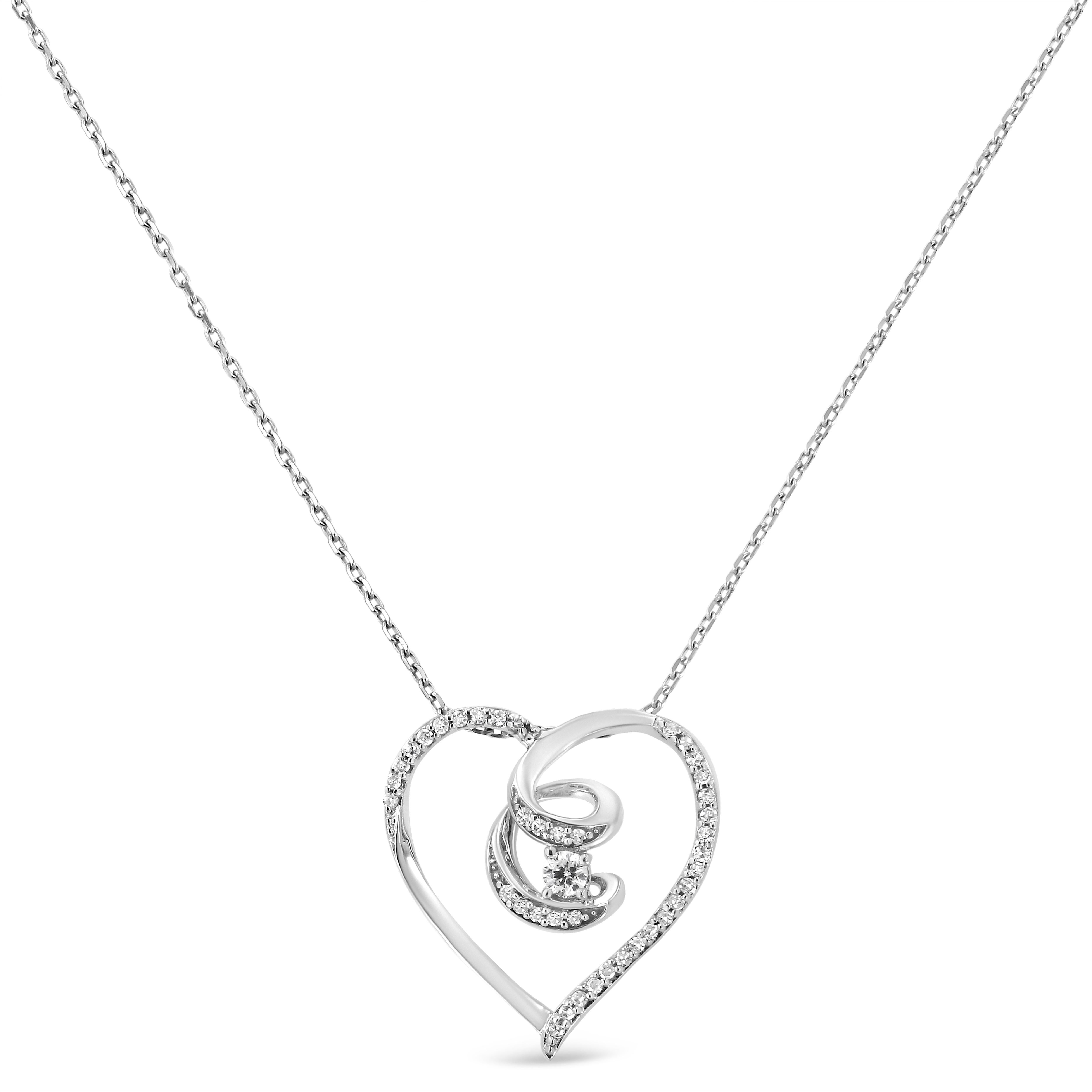 Célébrons la vie d'un être cher avec ce superbe collier pendentif en diamants. Un véritable ruban de conscience en argent sterling 925 aux courbes délicates pour créer une forme de cœur ouvert. Le ruban en forme de broche tombe à mi-chemin au milieu