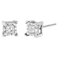 Pendientes de plata de ley .925 con diamante solitario engastado milagrosamente de 1/4 quilate