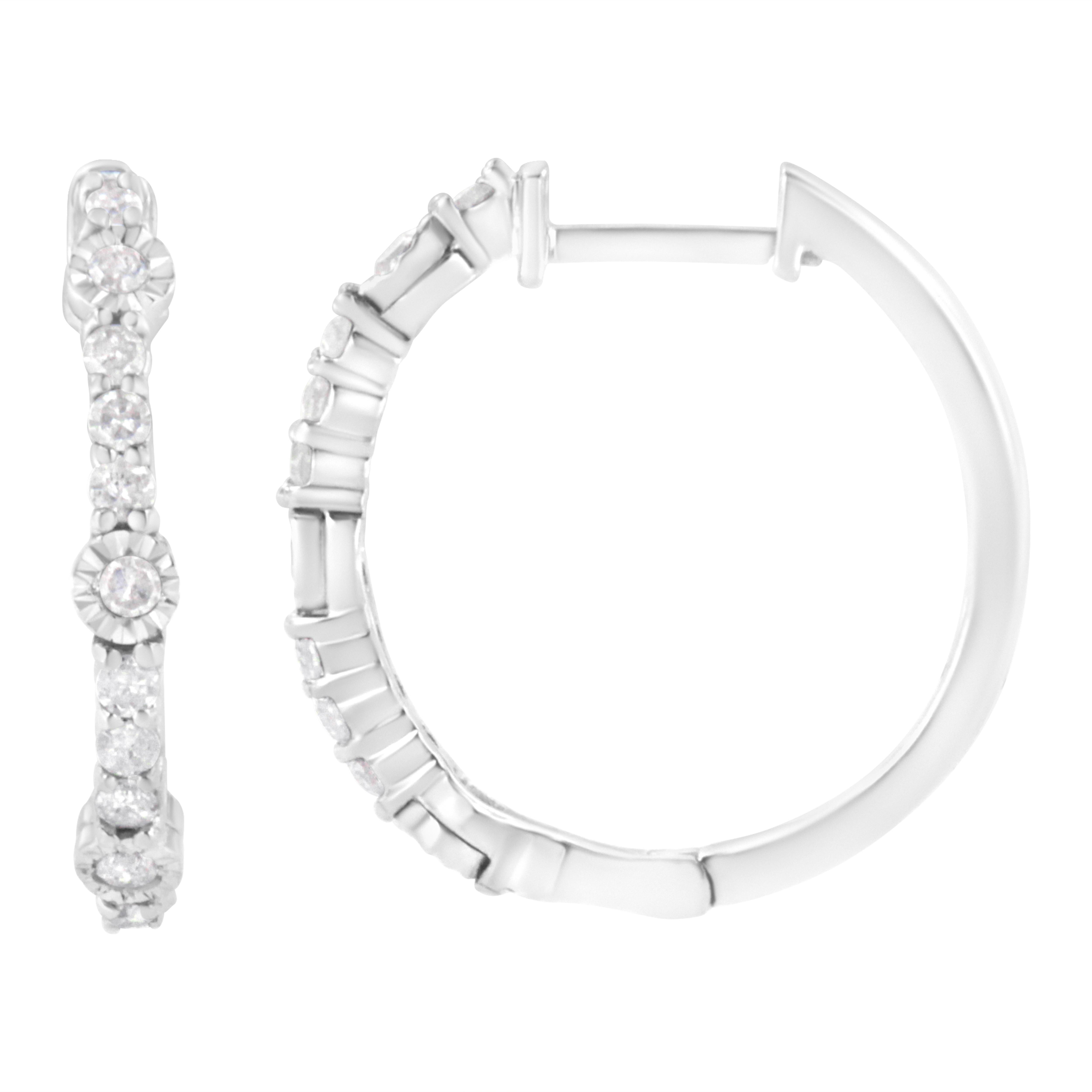 These glamorous sterling silver hoop earrings shimmer with 1/4ct TDW of diamonds. Round cut diamonds line the front of the hoops. Alternating with prong set diamonds 3 miracle set diamonds stand out and give this design a twist on the classic