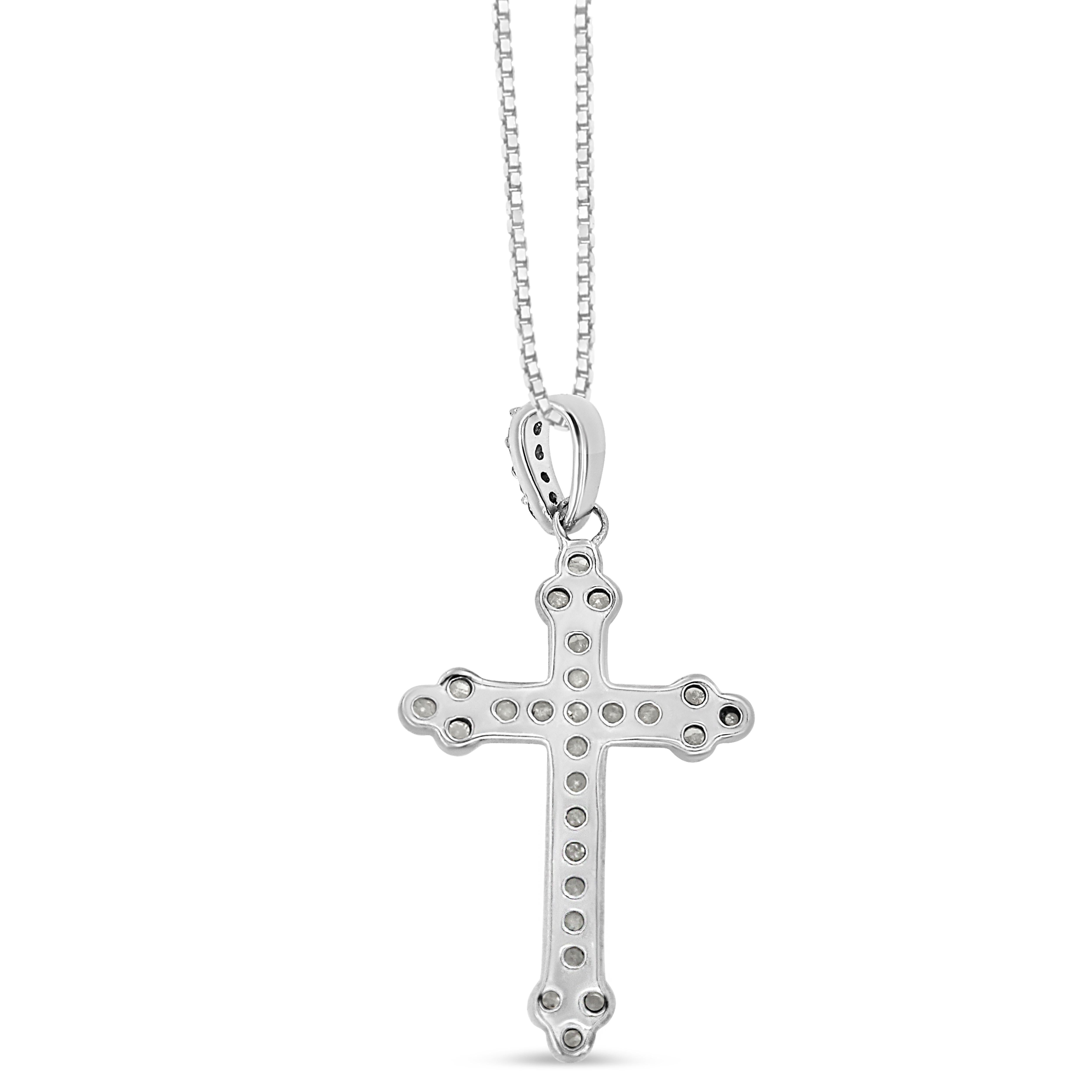 Celebrate your inner spirituality with this art-deco diamond cross pendant. This necklace is embellished with a 1/4 cttw of natural, round-cut diamonds. The cross is designed with extra flair as a trio of diamonds are at each end. The prong-set