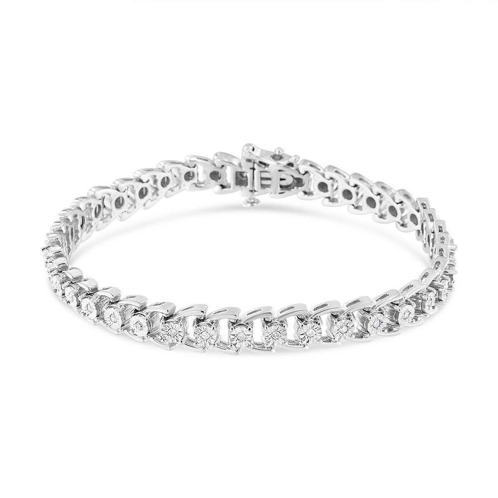Wrap your wrist in sparkling splendor with this sensational diamond composite open linked composite line bracelet. The miracle setting showcases 25 round-cut diamonds set in classic white .925 sterling silver. The bracelet has a total diamond weight
