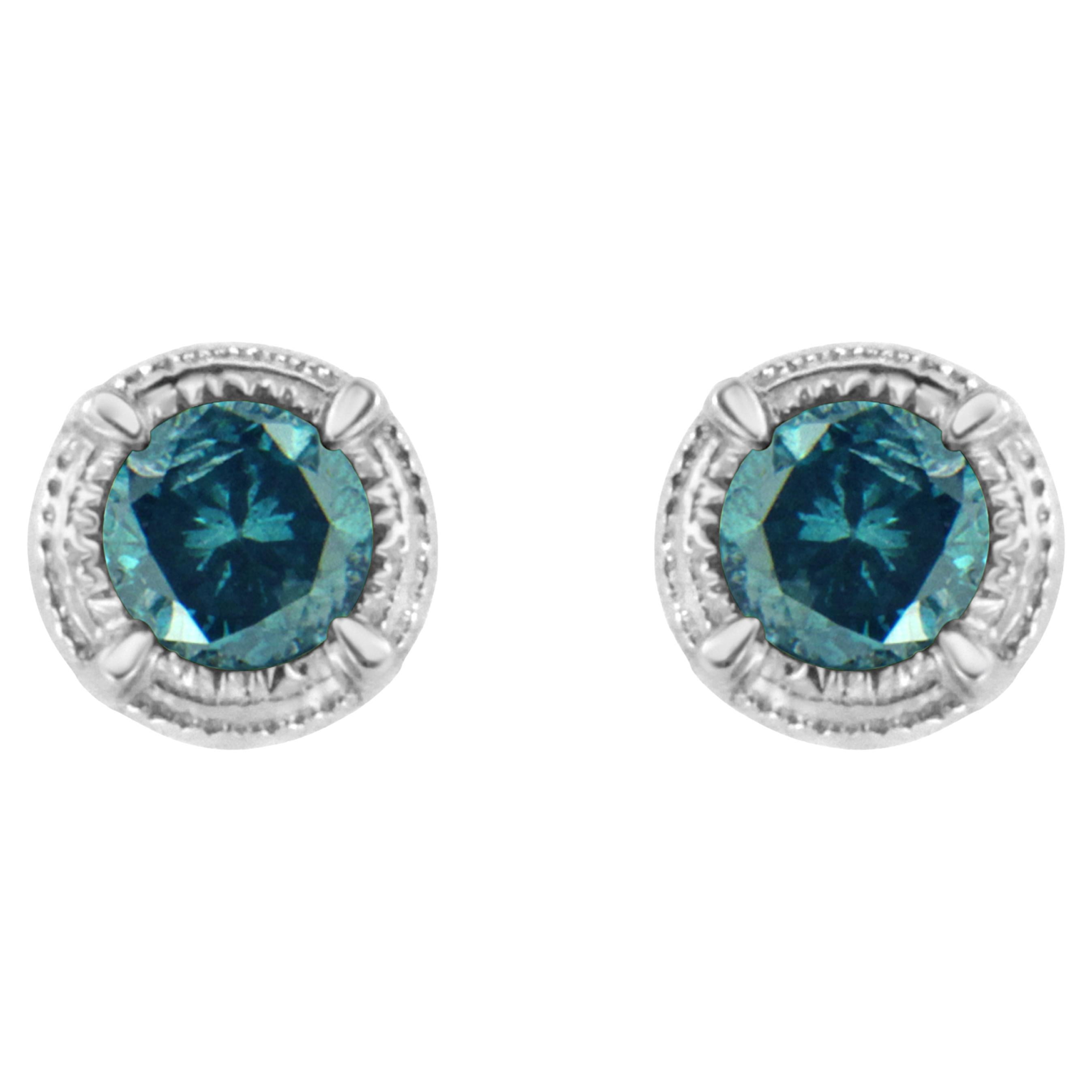 .925 Sterling Silver 1/4 Carat Treated Blue Diamond Solitaire Stud Earrings For Sale