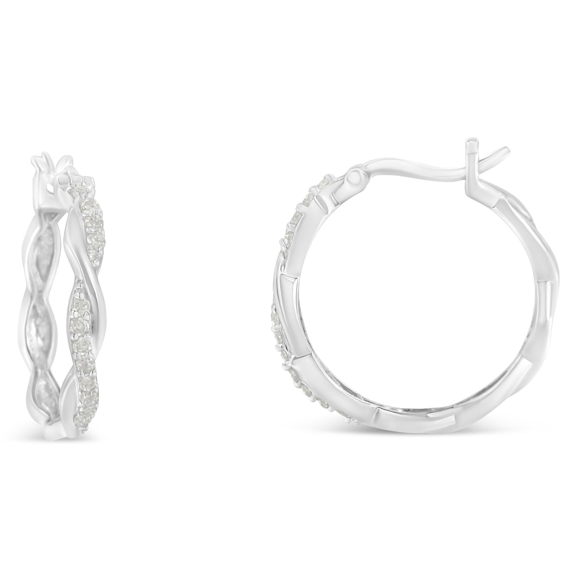 Sophisticated twisted hoop earrings made with the finest .925 sterling silver and genuine diamonds. These white plated colored earrings include 24 rose-cut shaped diamonds in a pave setting. The diamonds are craved in a layer that interlaces with