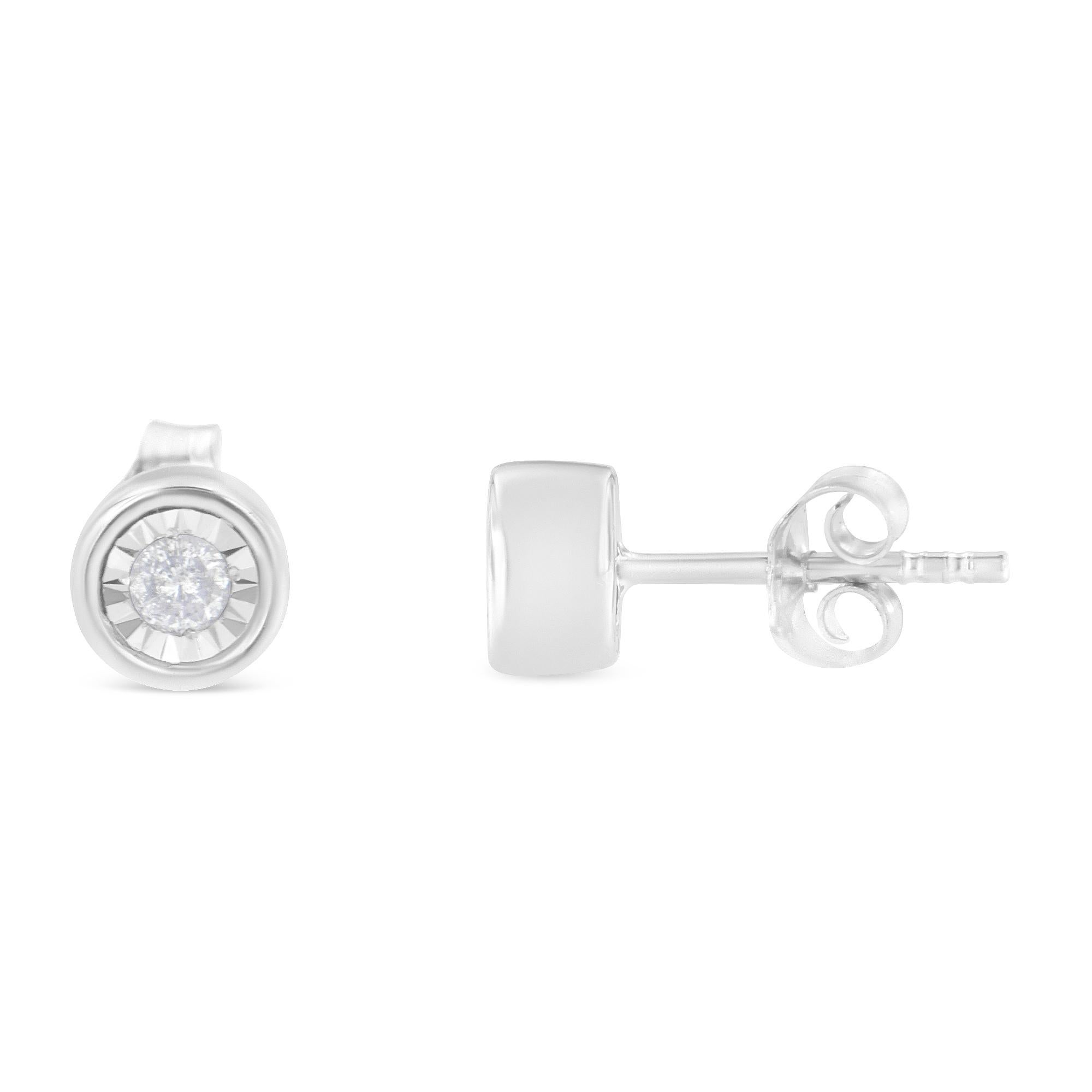 Frame her face with the bold and impressive look of these fabulous diamond bezel stud earrings. Crafted in fabulous sterling silver, each earring features a mesmerizing round-cut 0.1ct. diamond in bezel miracle setting. Captivating with 0.2ct TDW of